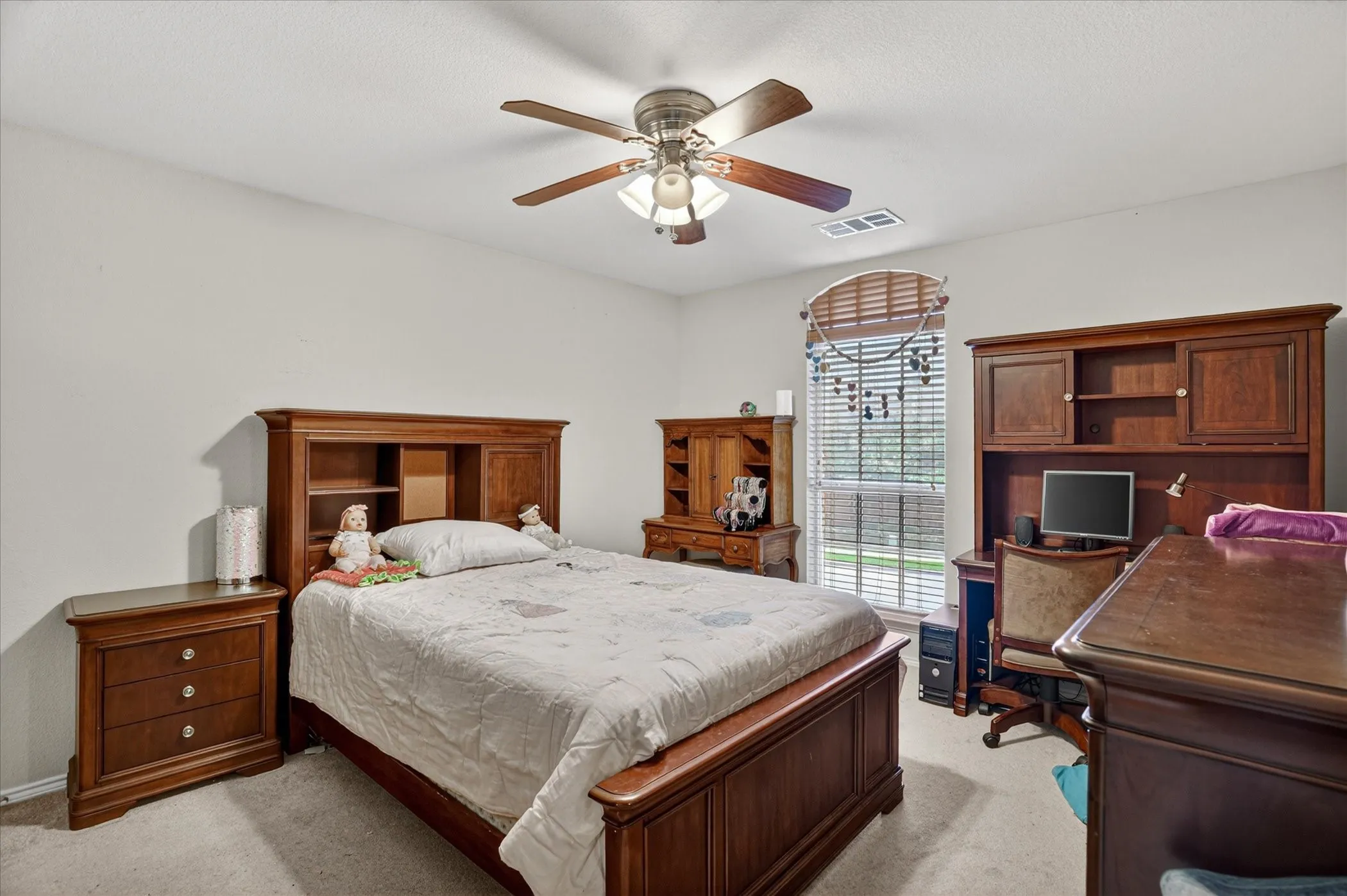 Bedroom featuring neutral-toned walls and carpet flooring