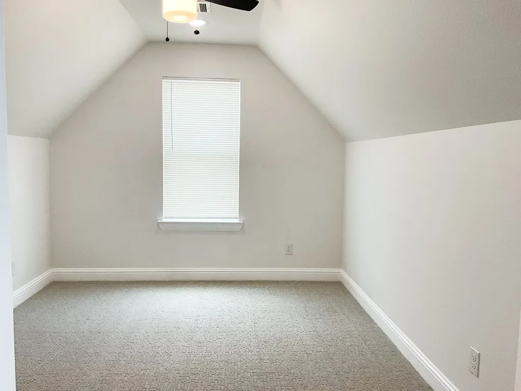 Upstairs bonus room with closet.