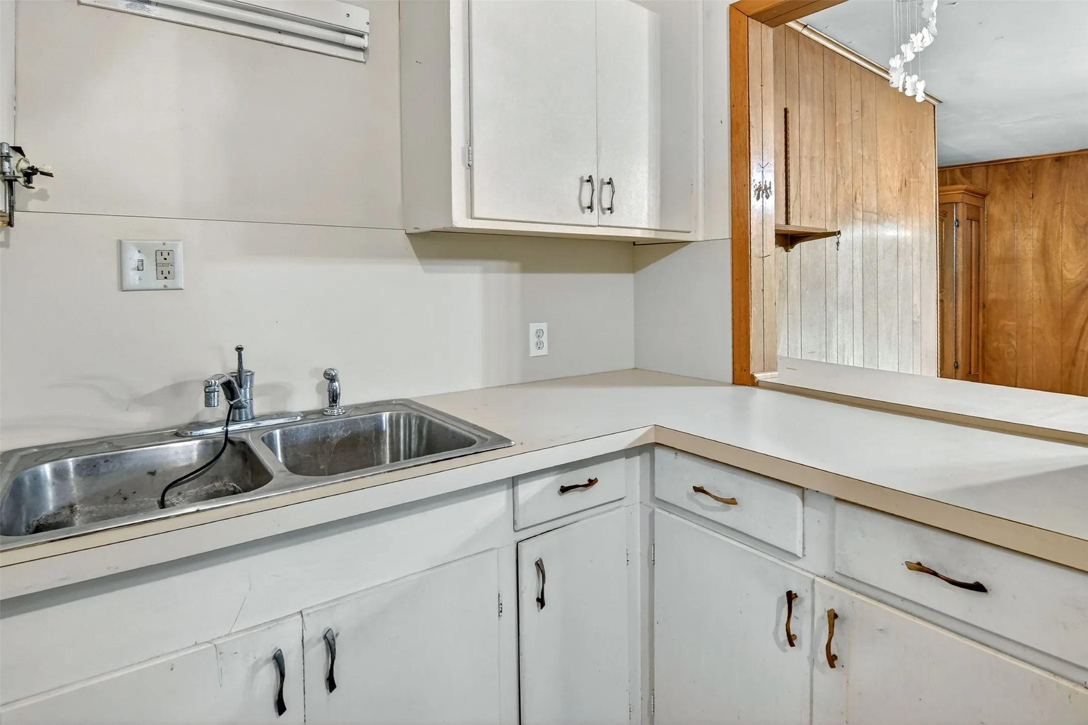 Kitchen featuring pass-through to den.