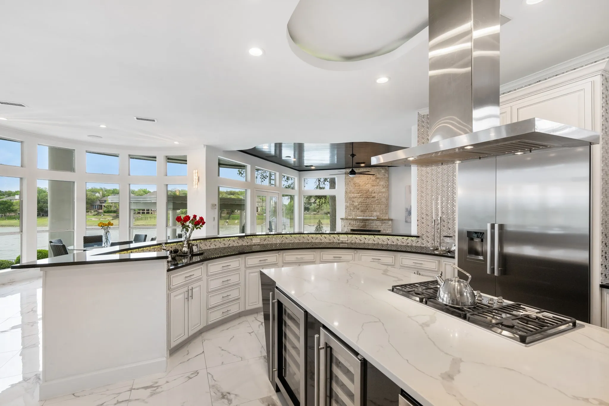 This luxurious kitchen is the heart of the home, centrally located so all open living spaces flow around it, with stunning view and abundant natural light, making it perfect for entertaining, gatherings, and everyday life.