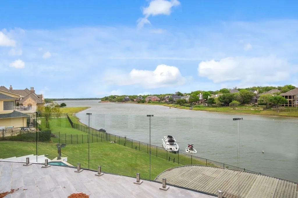 Private balcony overlooking the lake, offering panoramic views and a front-row seat to waterfront living. One of four available balconies, It's perfect for relaxing mornings, sunset evenings.