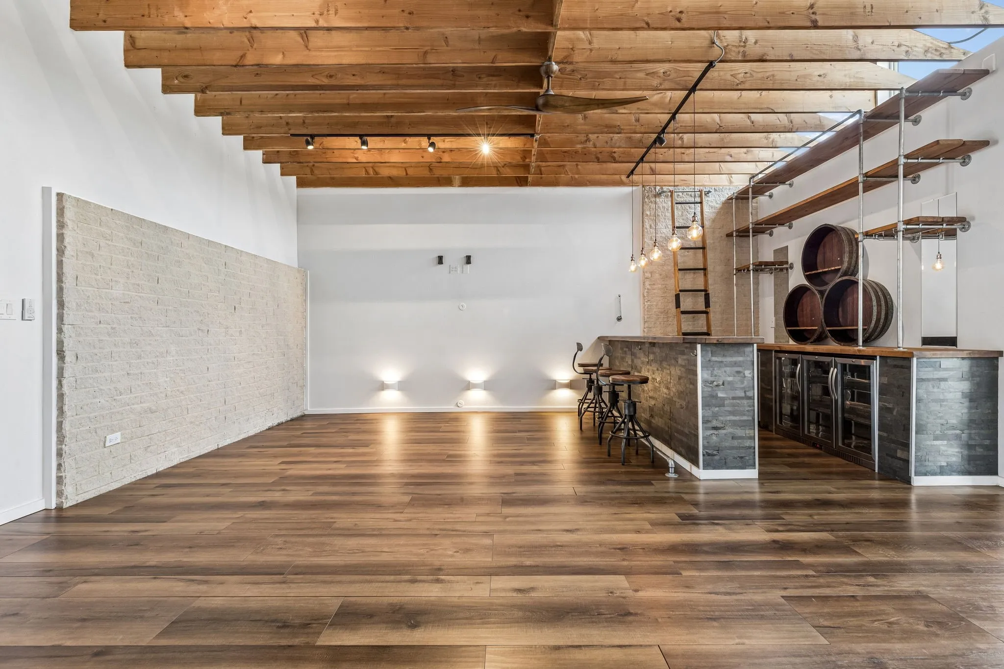 A straight on view of the first living room with up lights.