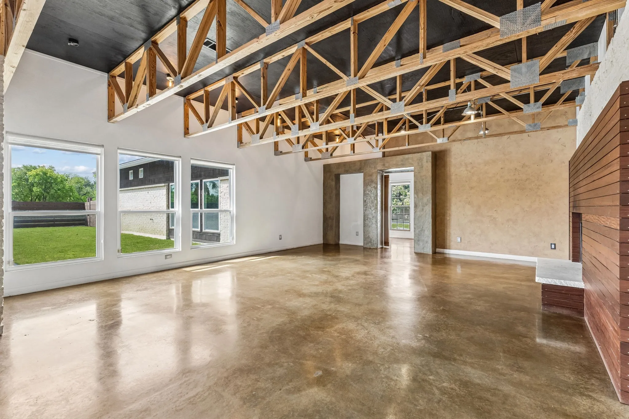 Another angle and view of the den and windows looking out to the pool.