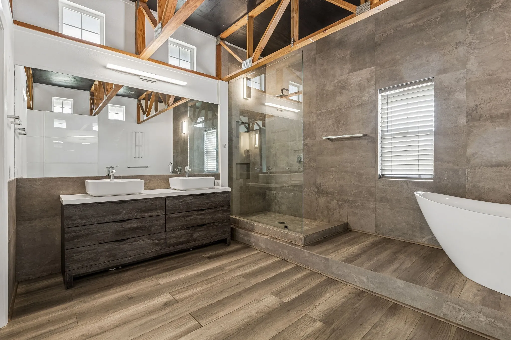 Totally remodeled primary bathroom with separate vanities.