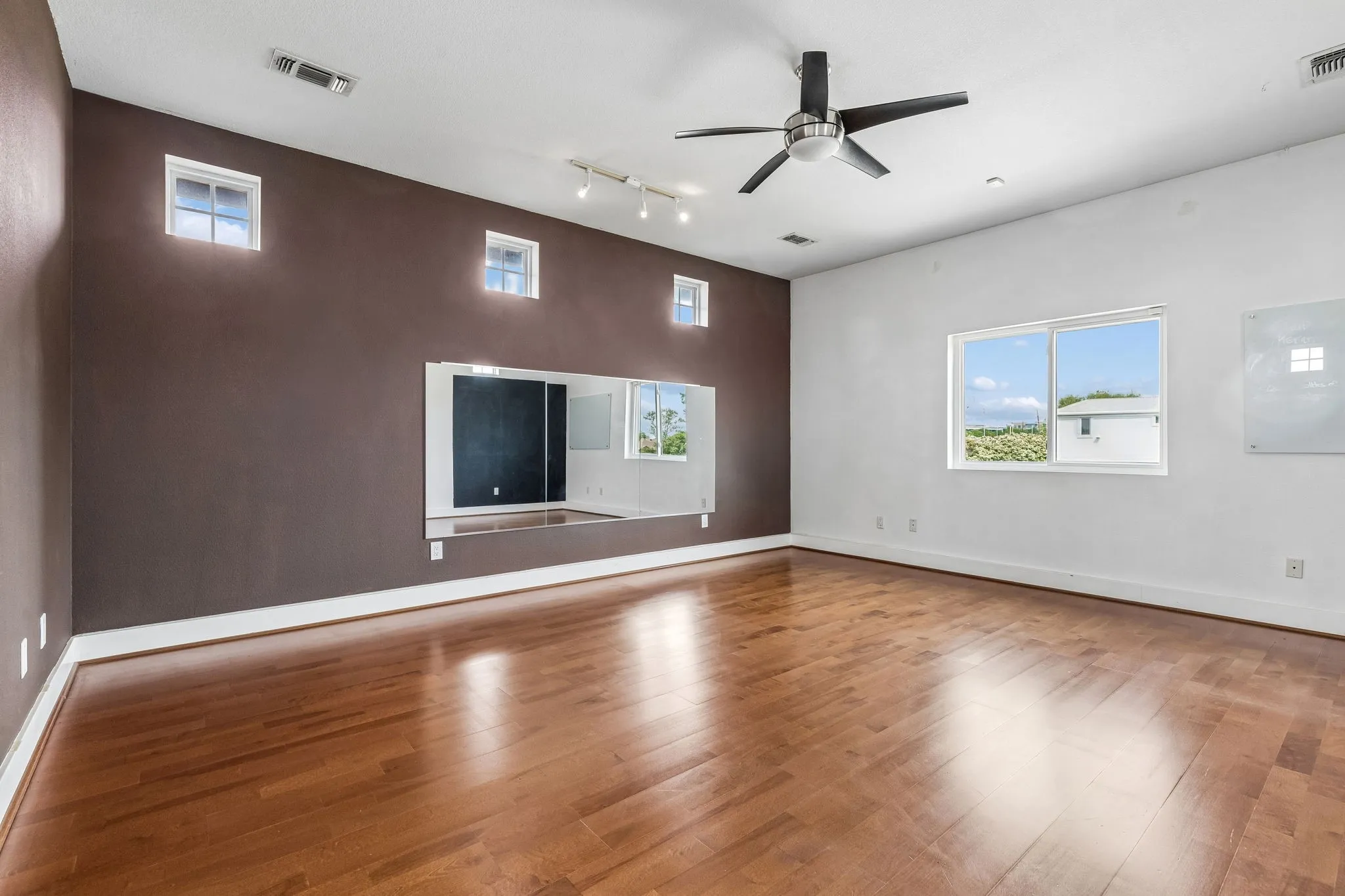 Large bonus room with separate staircase.  This could have a pool table, work out equipment or a combo. It has wood flooring.