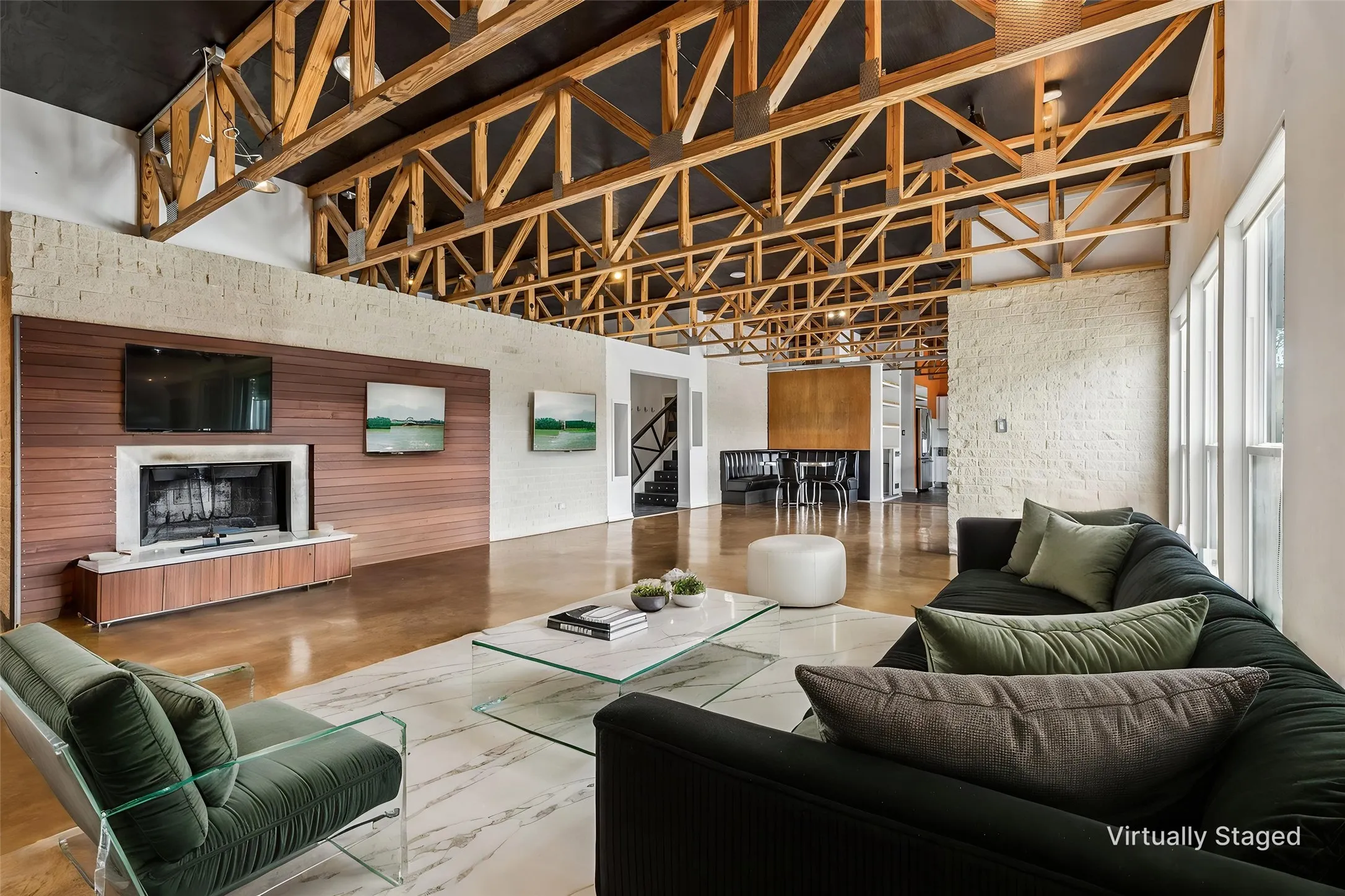 Staged second living area.  Stained concrete flooring.