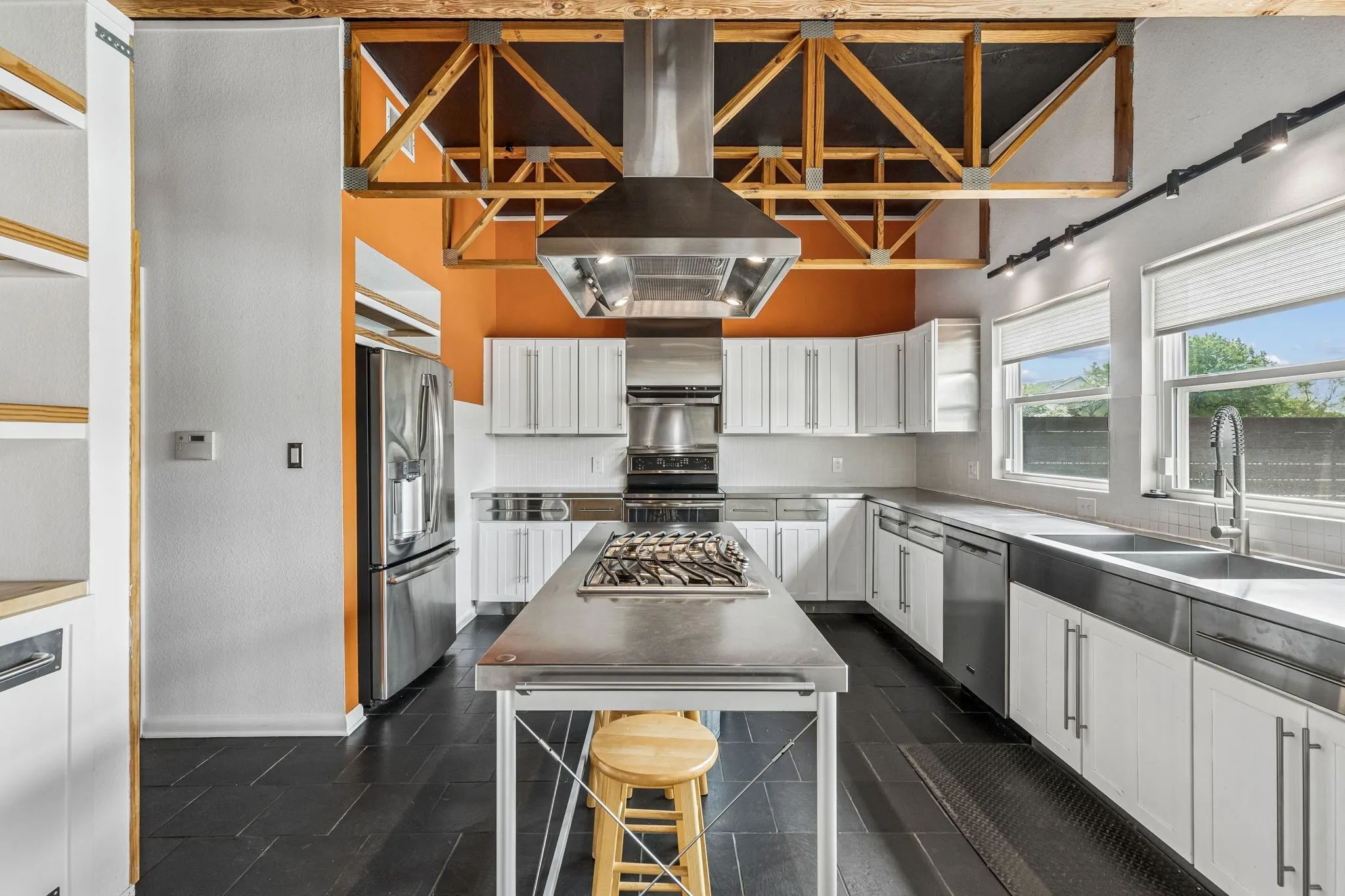 Another view of the kitchen and extra cabinets to the left.  There is room for an extra mini fridge by the trash pull out.