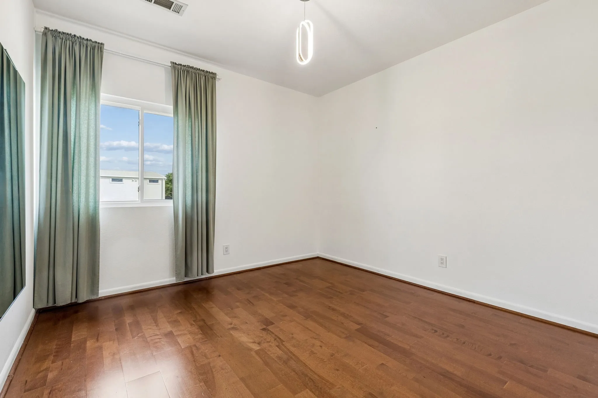 Bedroom 3 up with wood flooring.