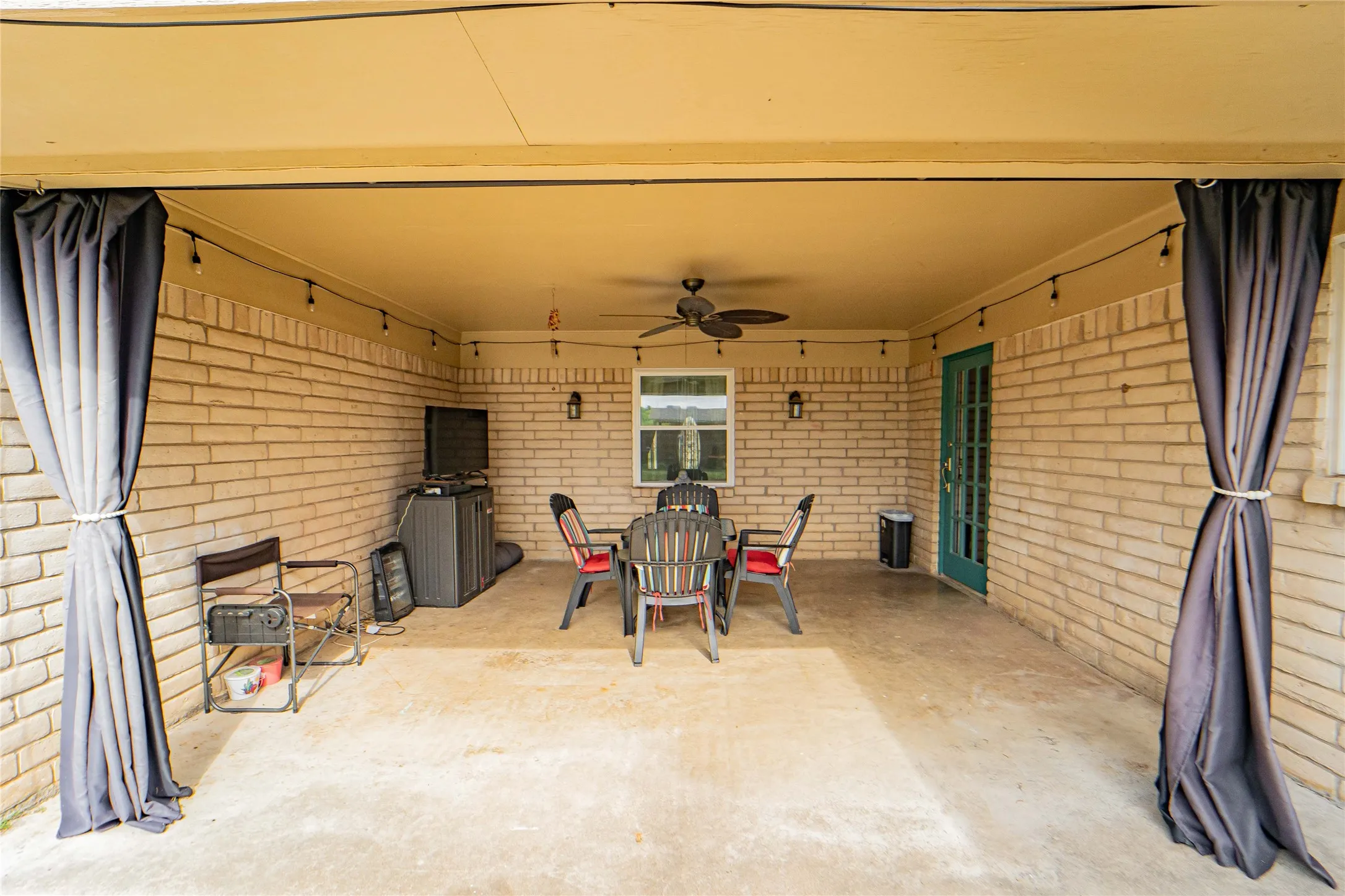 View of patio featuring a ceiling fan and outdoor dining space