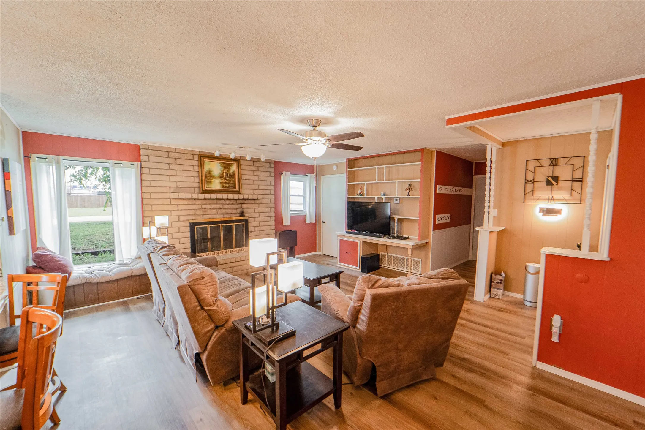 Living area with a fireplace and built-ins
