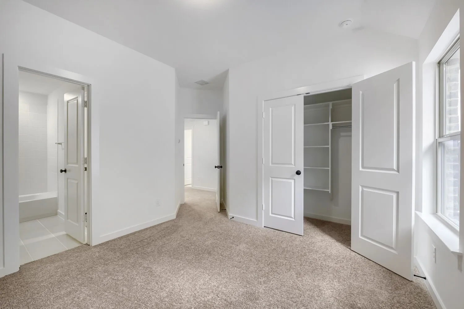 Room featuring carpet flooring and white walls