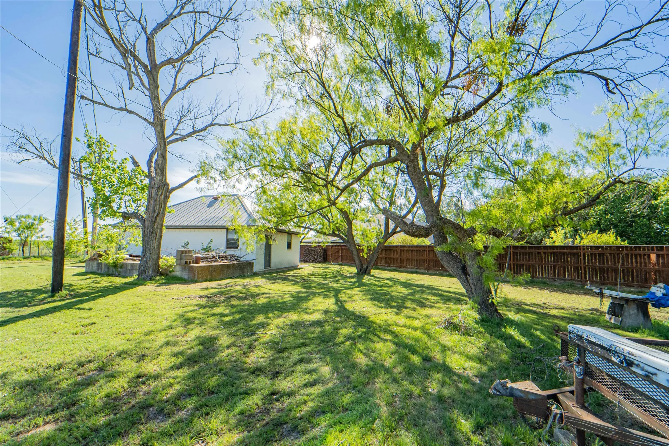 View of the detached garage located outside the fenced backyard.