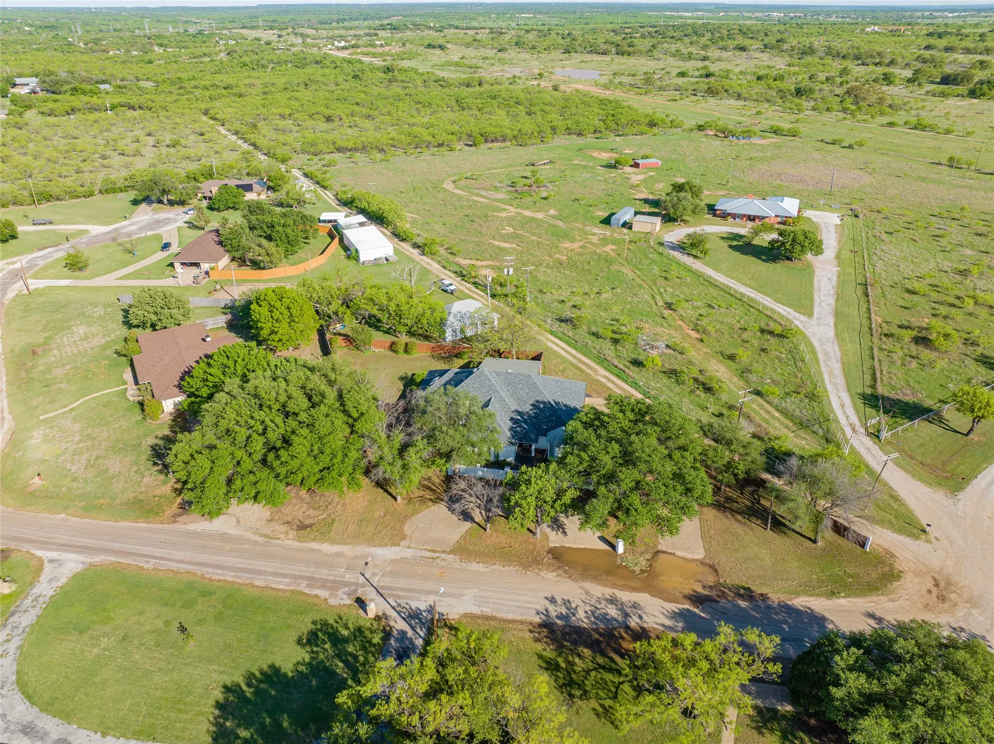 Aerial view of sparsely populated area behind the home.