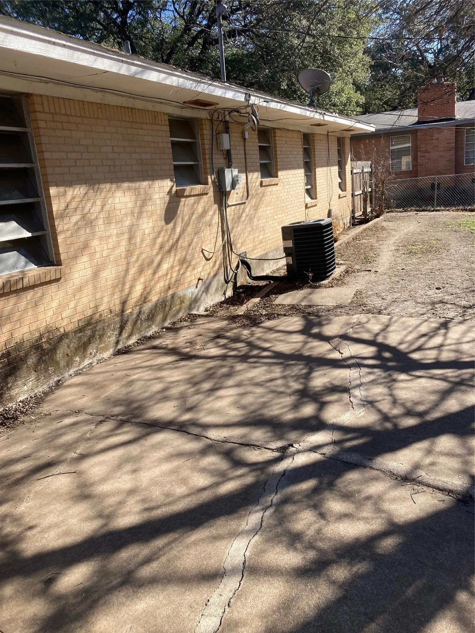 View of side of home with brick siding