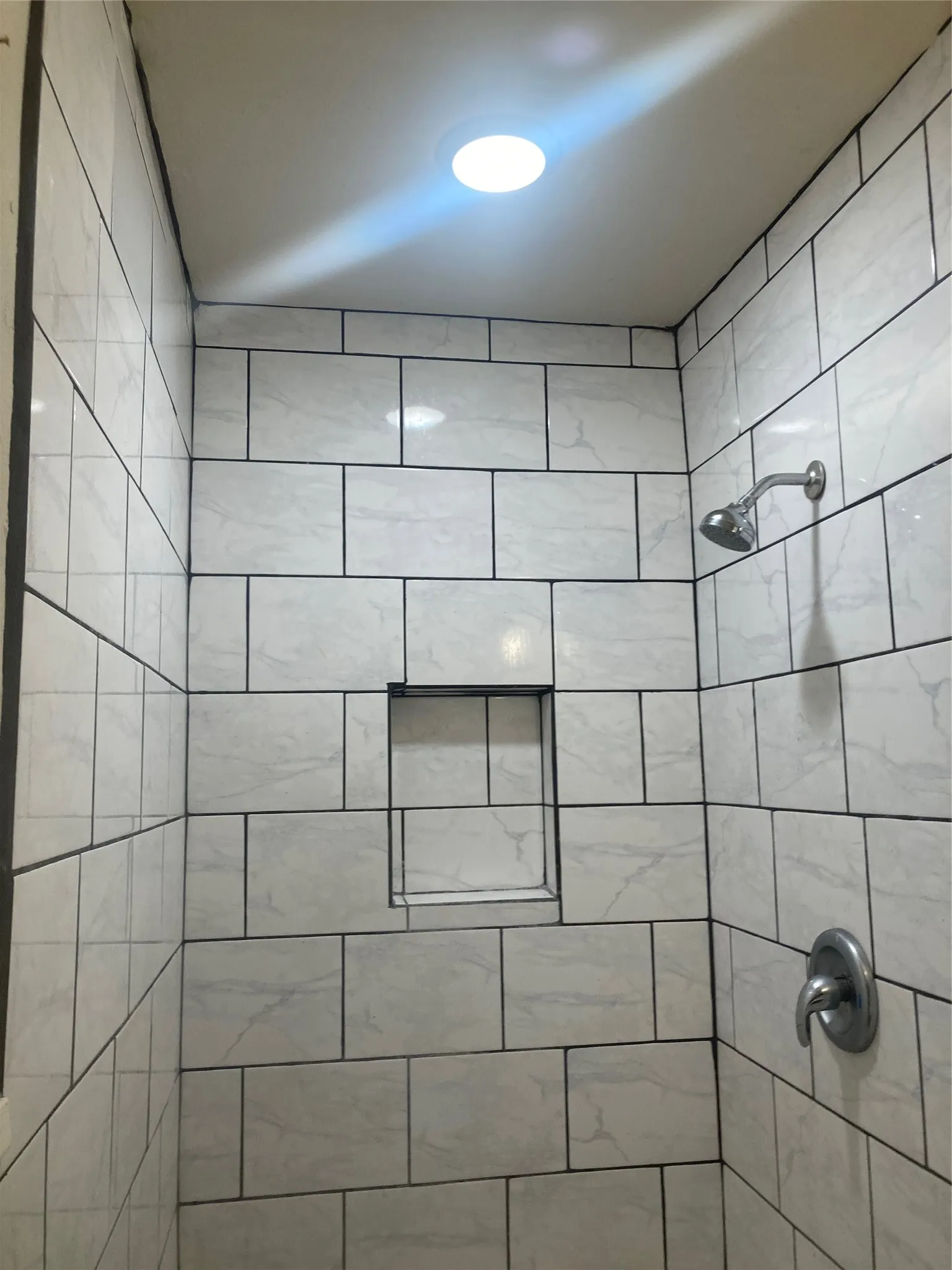 Bathroom view of tiled shower