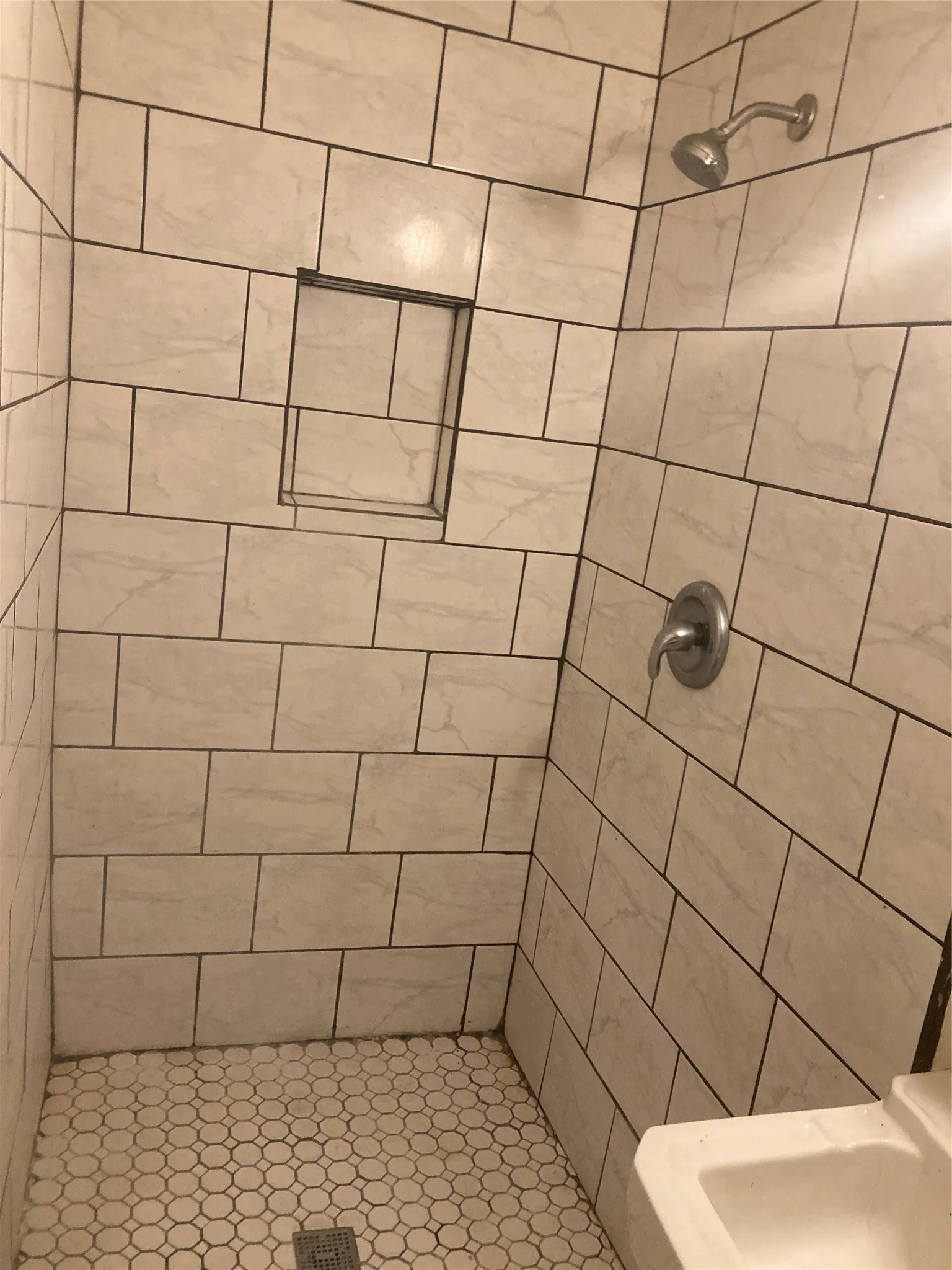 Full bathroom with a stall shower