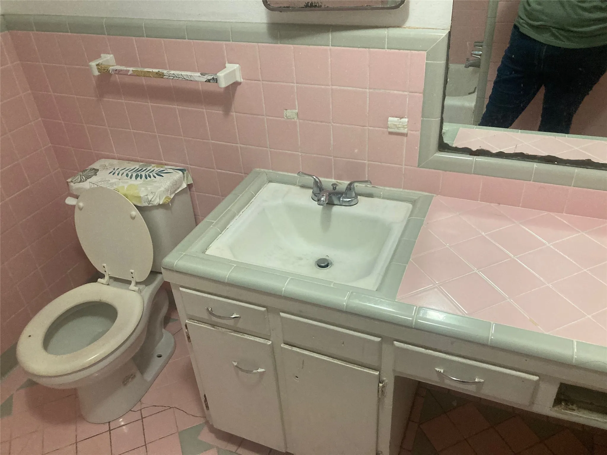 Full bath with vanity, light tile patterned floors, tile walls, and a shower with shower curtain