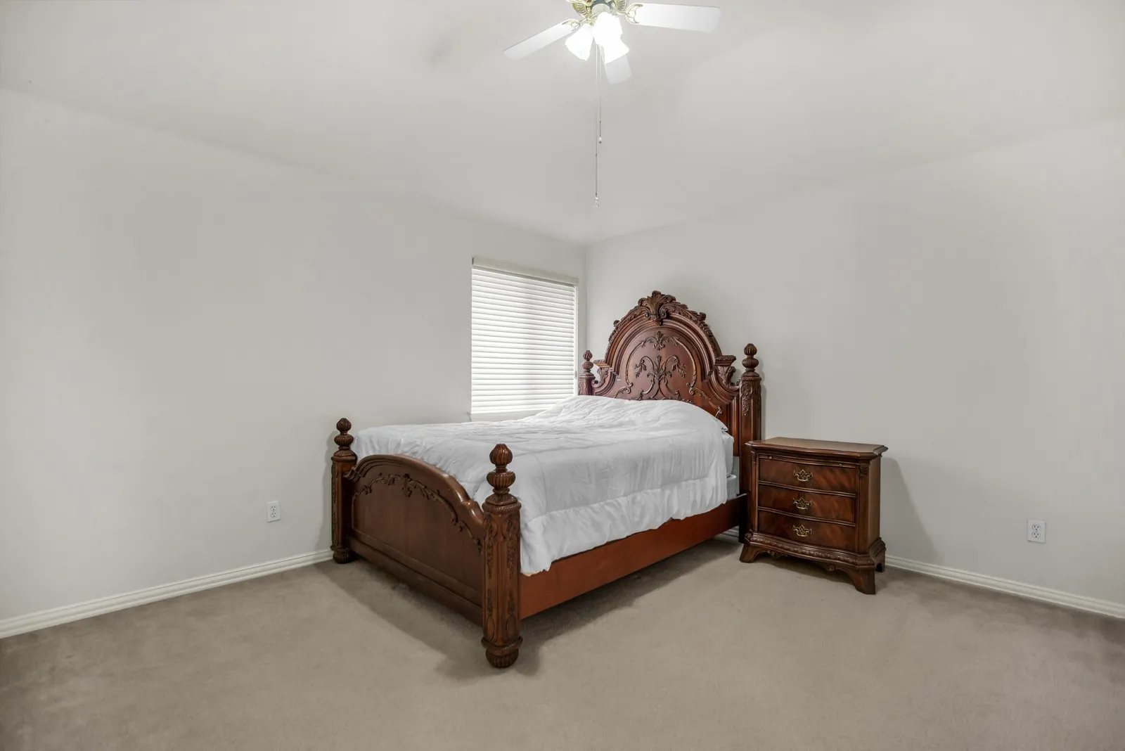Bedroom with carpet flooring and a ceiling fan