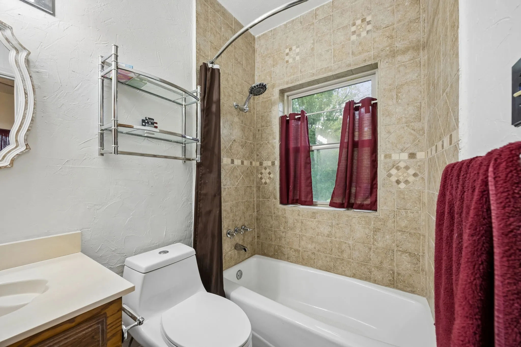 Full bathroom featuring a white porcelain tub and shower combination with a curved shower rod