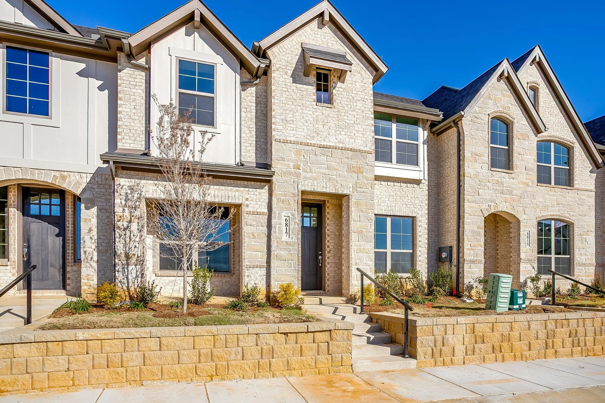 View of front facade featuring stone siding