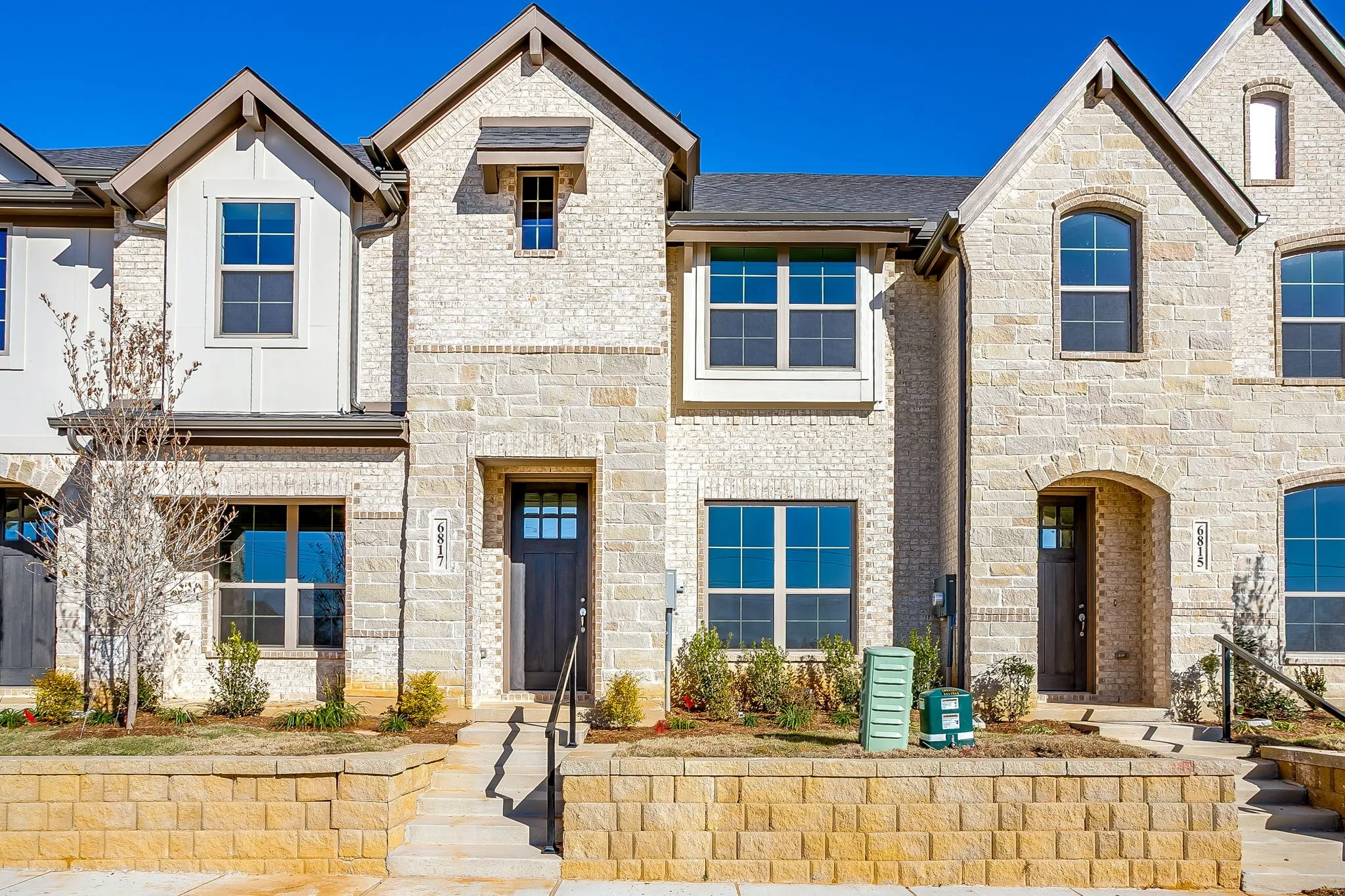 French provincial home with stone siding