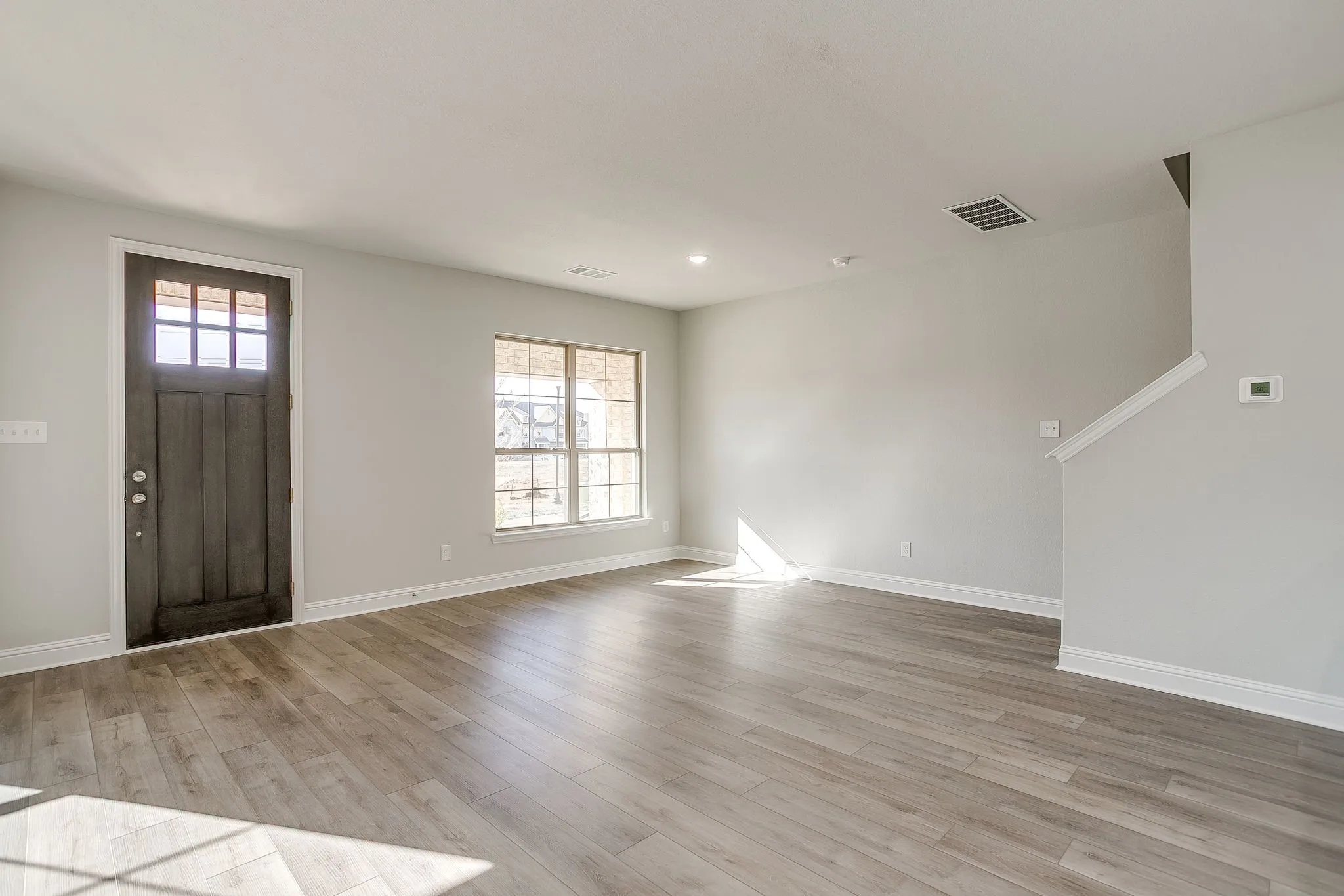 Foyer entrance featuring light wood-style flooring and recessed lighting