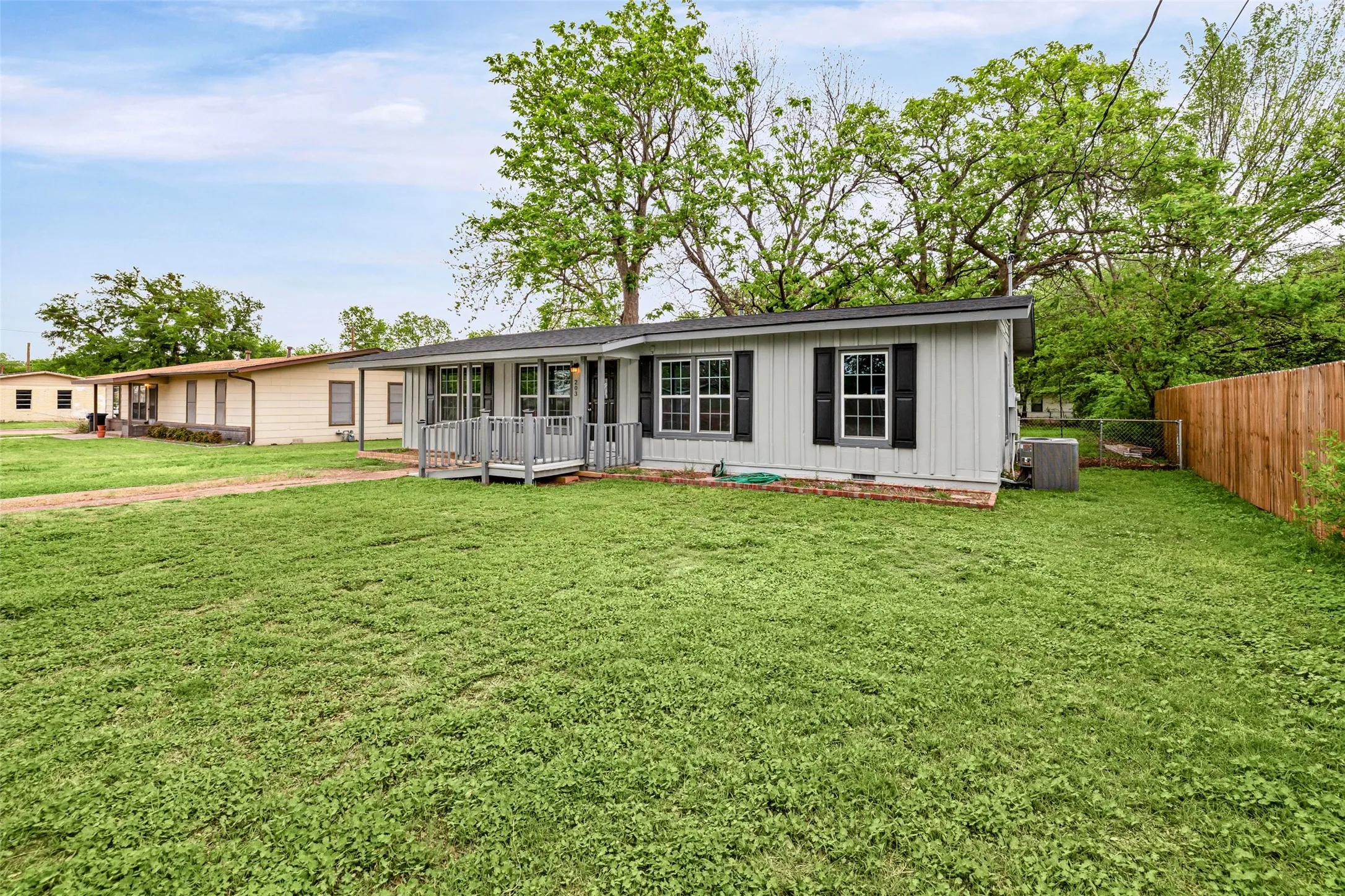 View of front of house with board and batten siding