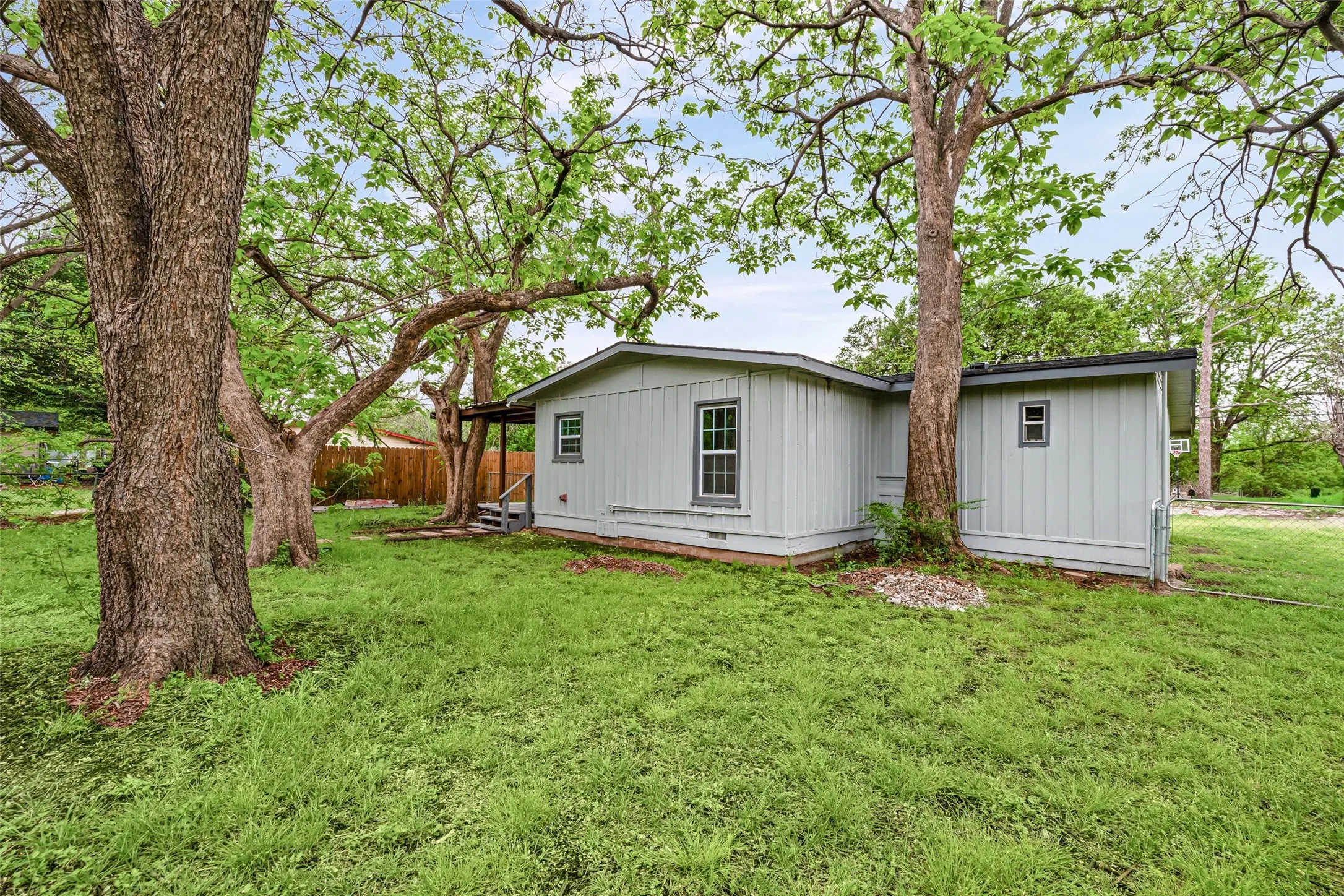 Rear view of property featuring board and batten siding