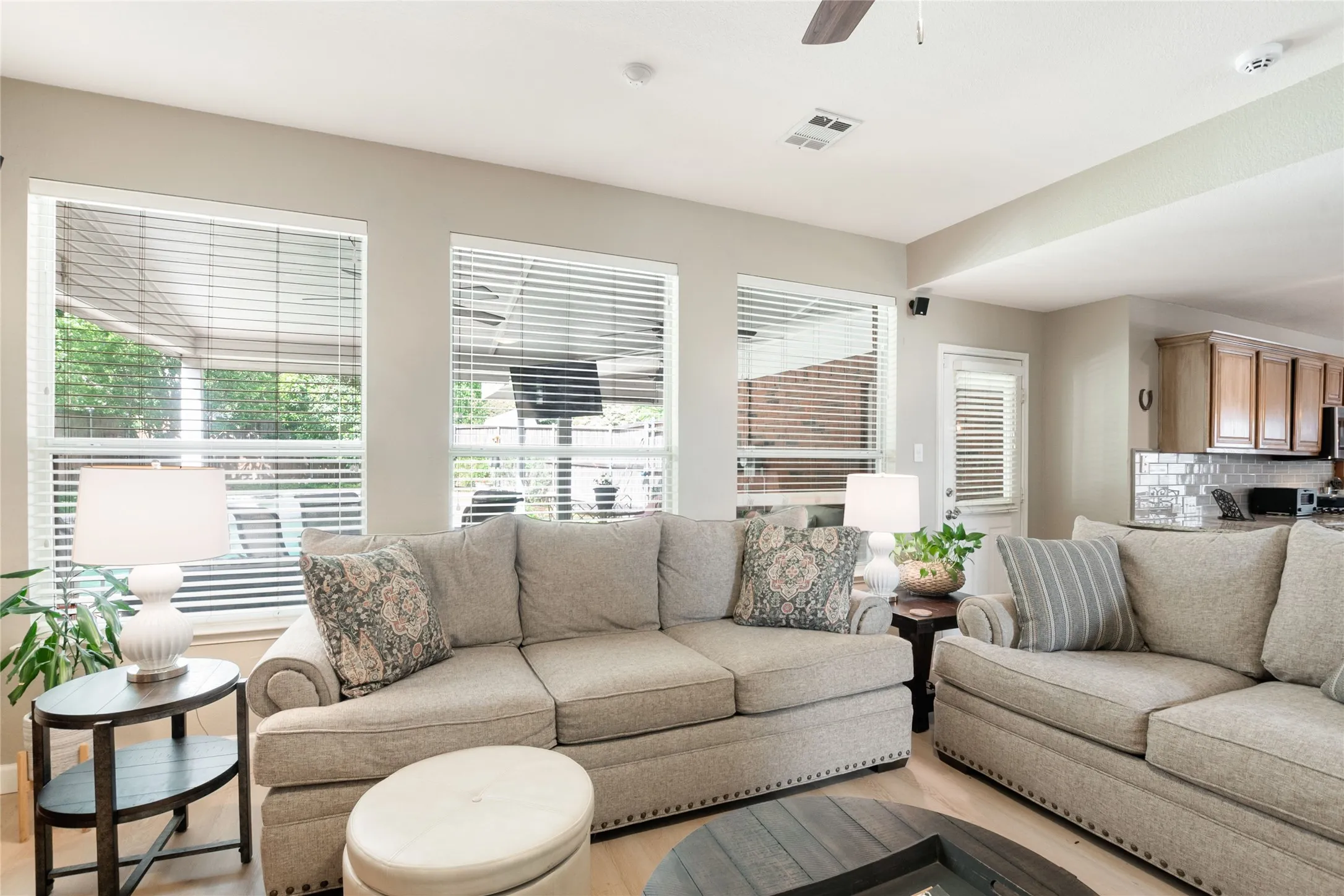 Large windows overlooking patio and pool