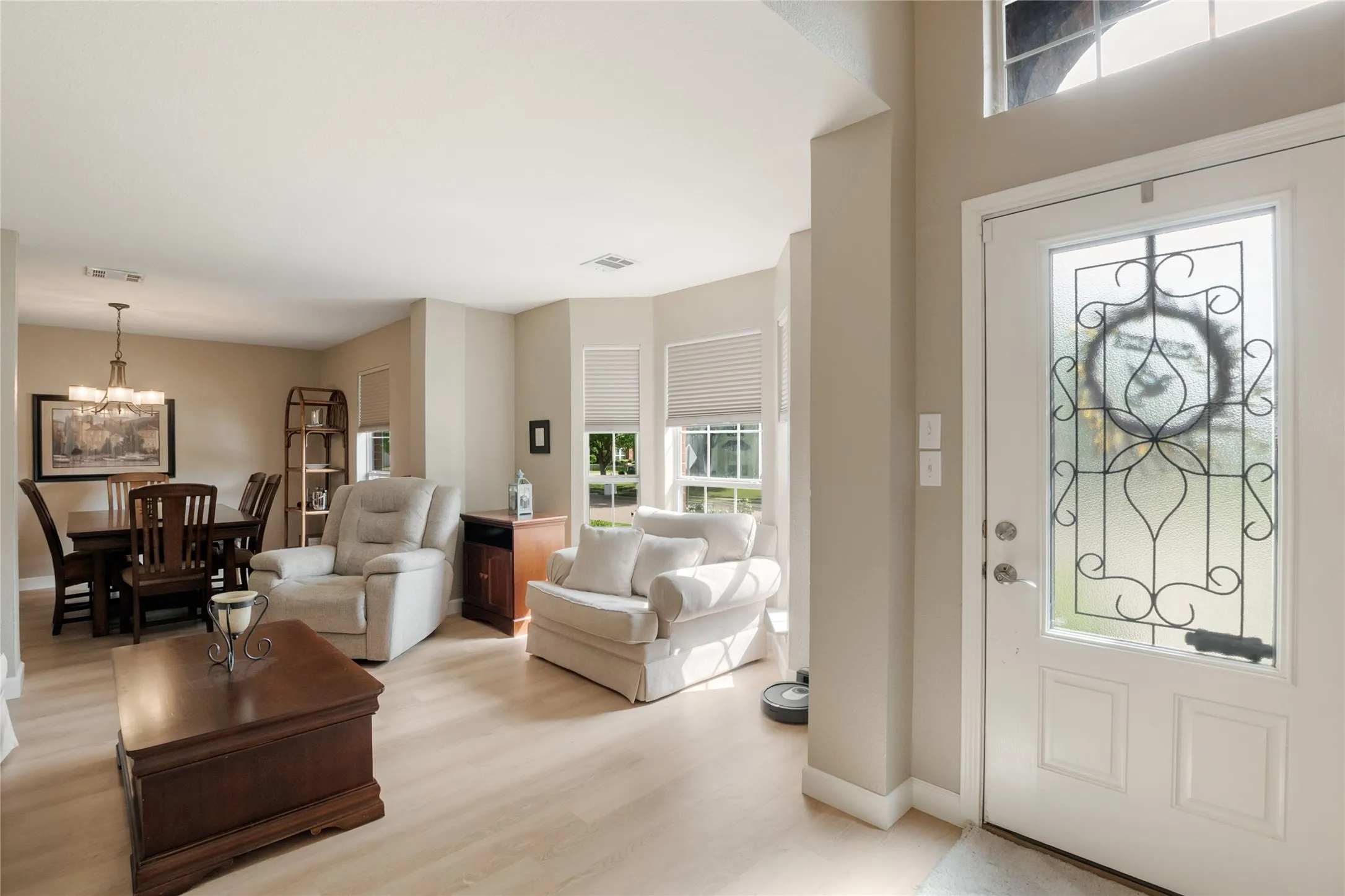 Warm entry with expansive view of formal areas
