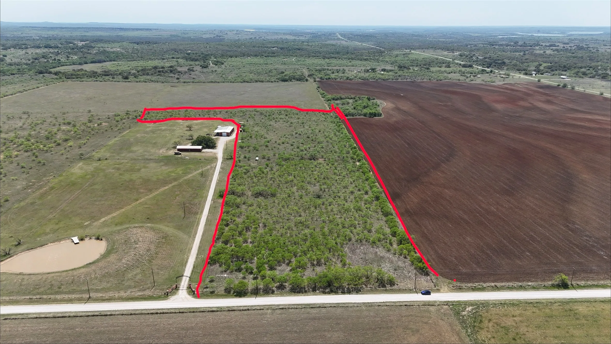 Overview of rural landscape with property boundaries highlighted and large plots for crops