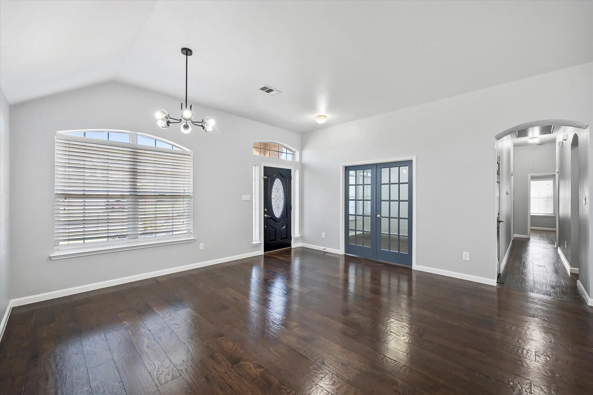 Living area with double french doors to the office