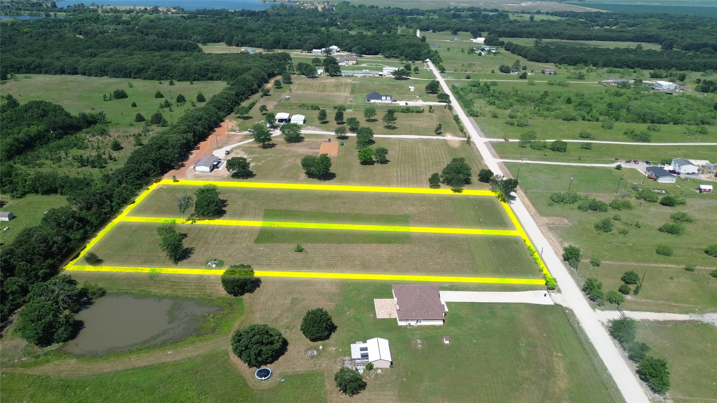 Aerial perspective showcasing multiple land parcels with clear boundary markings