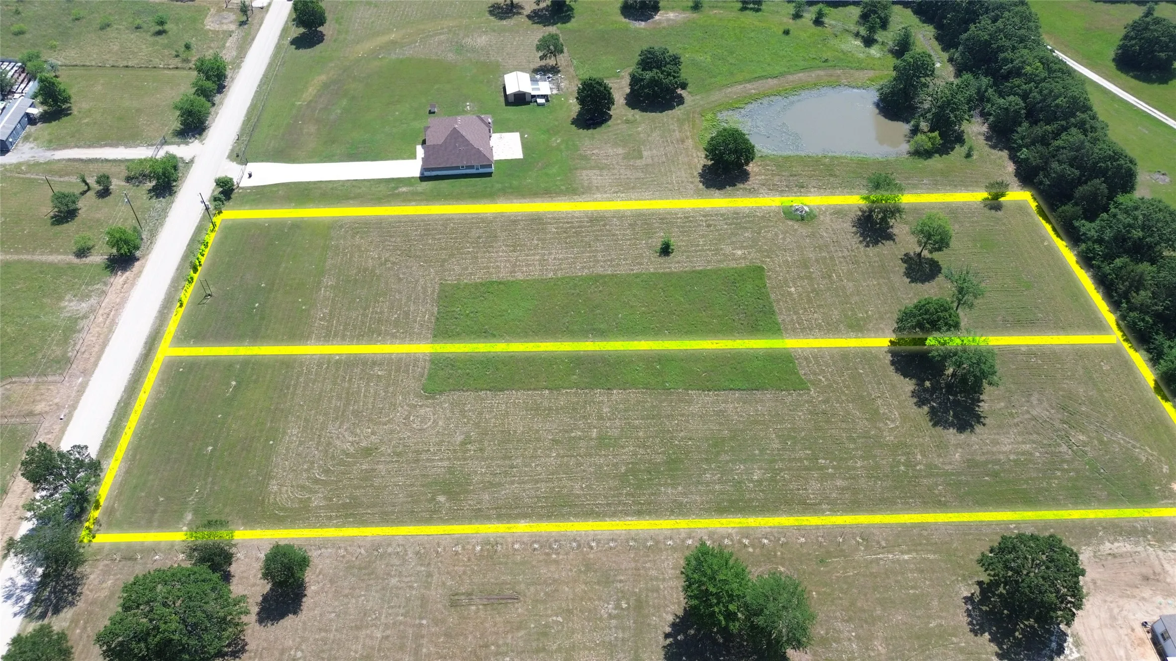 Expansive land parcels outlined in yellow with significant road frontage