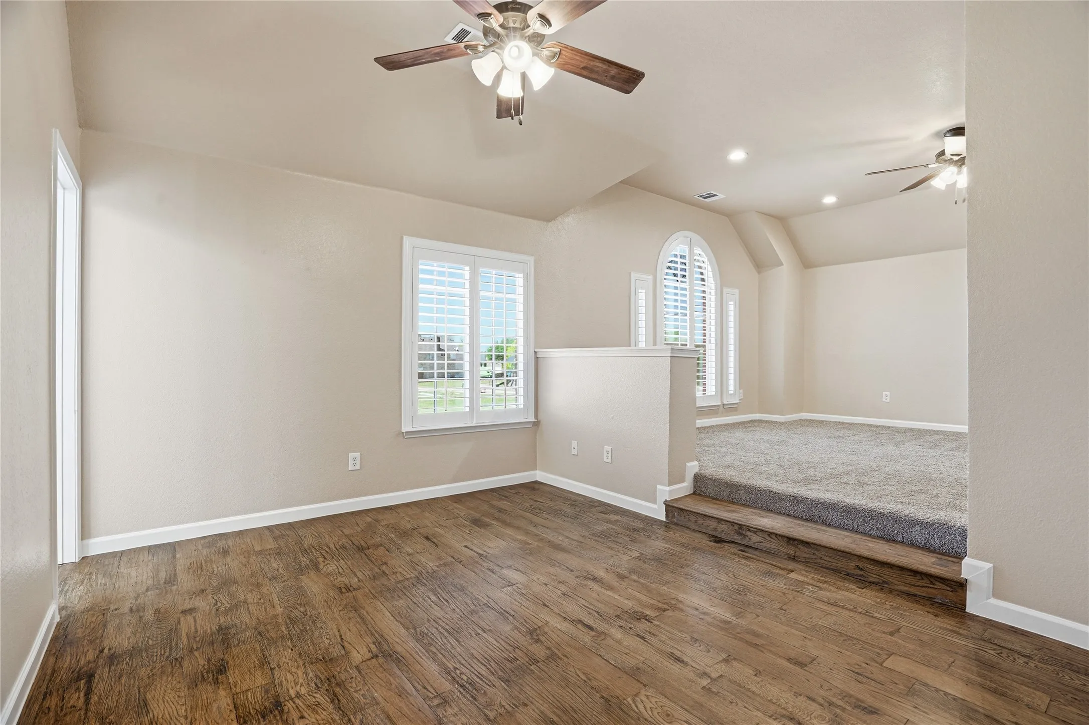 Primary Bedroom  featuring ceiling fan, dark wood-style flooring, lofted ceiling, and recessed lighting