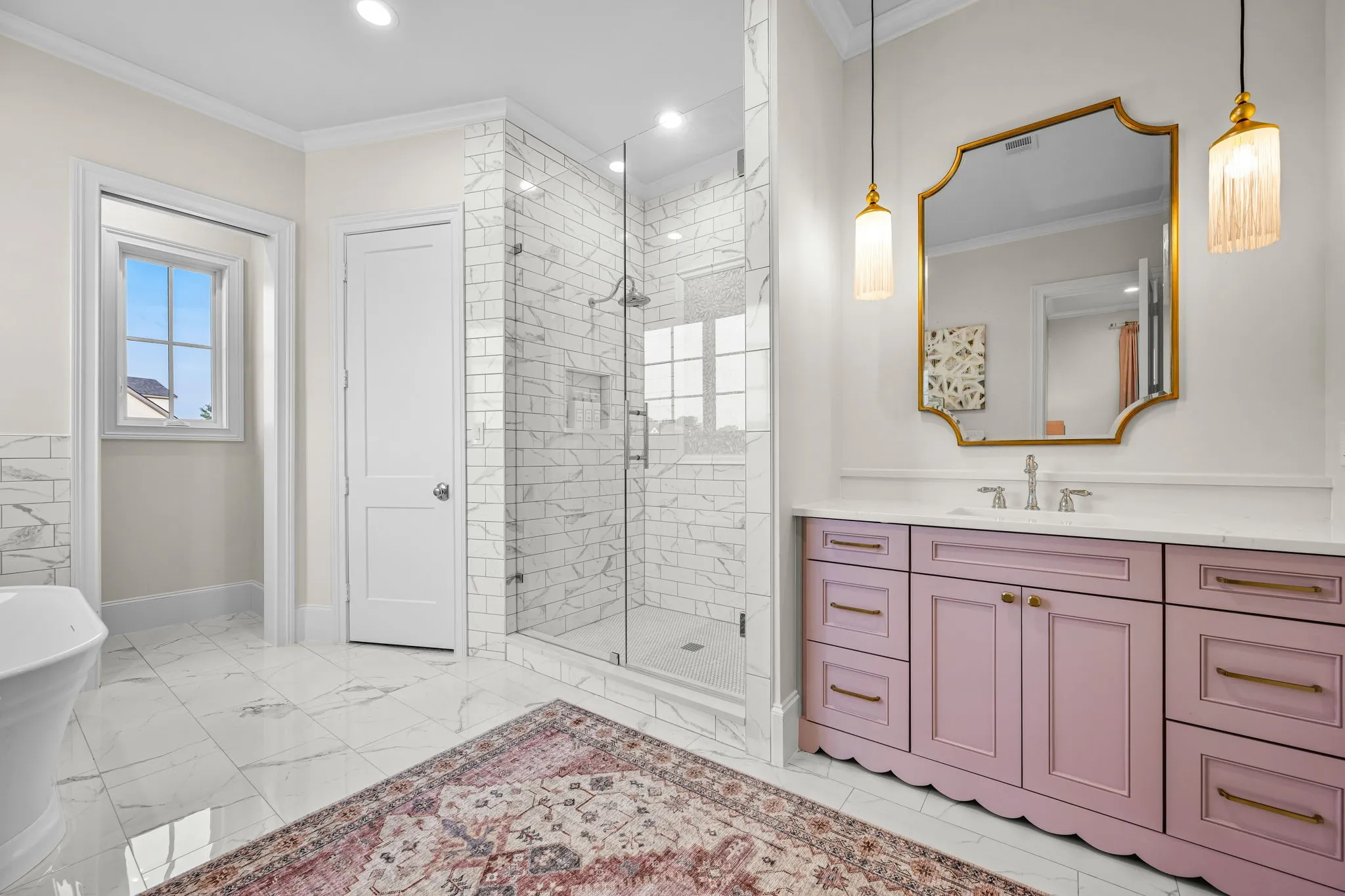 Ensuite bath also fit for a princess with scalloped edged vanity to and beautiful sconces adding detail to the room