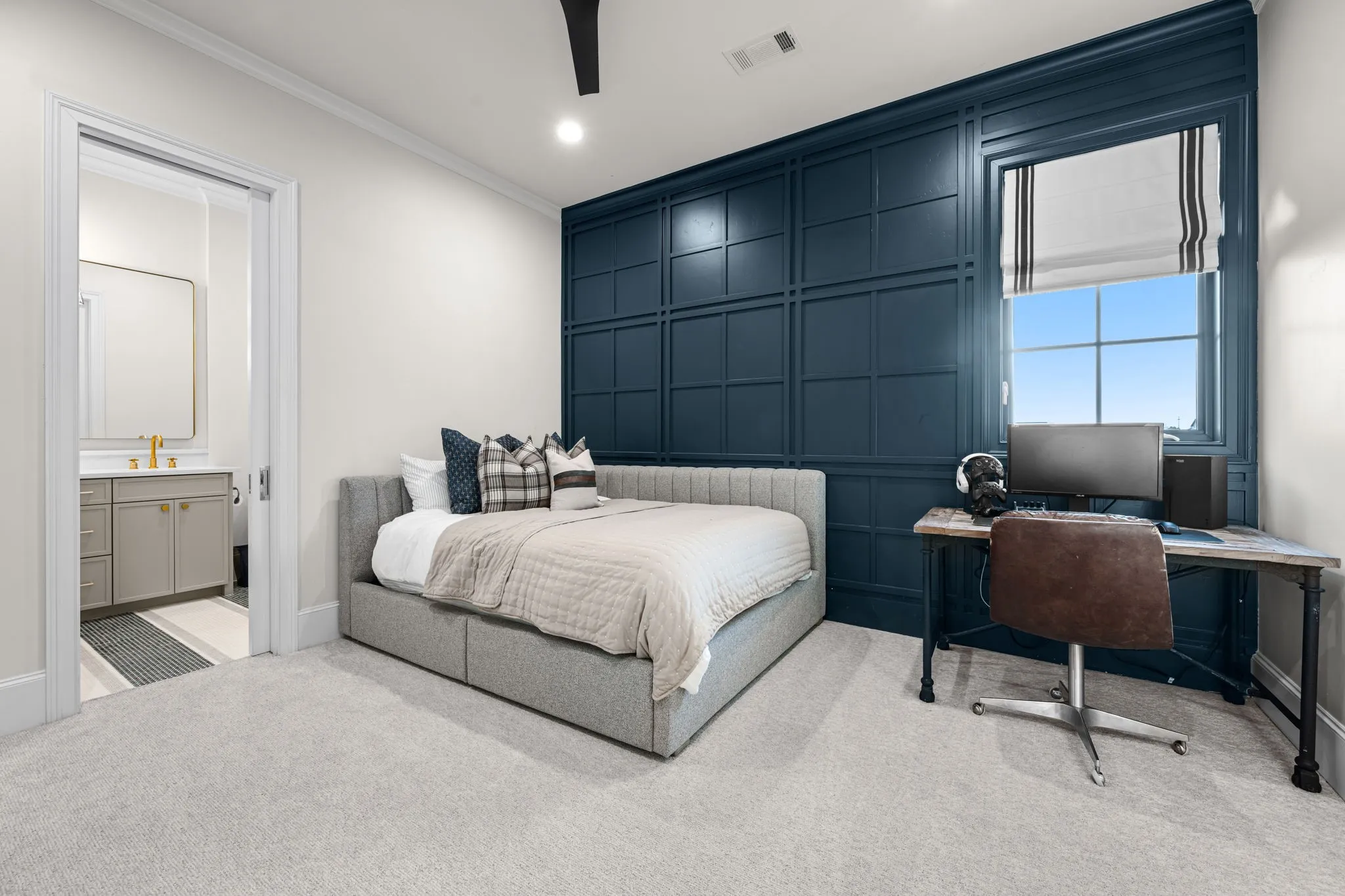 Sophisticated accent wall in navy really sets this room apart. 13x13 makes is a nicely sized secondary bedroom