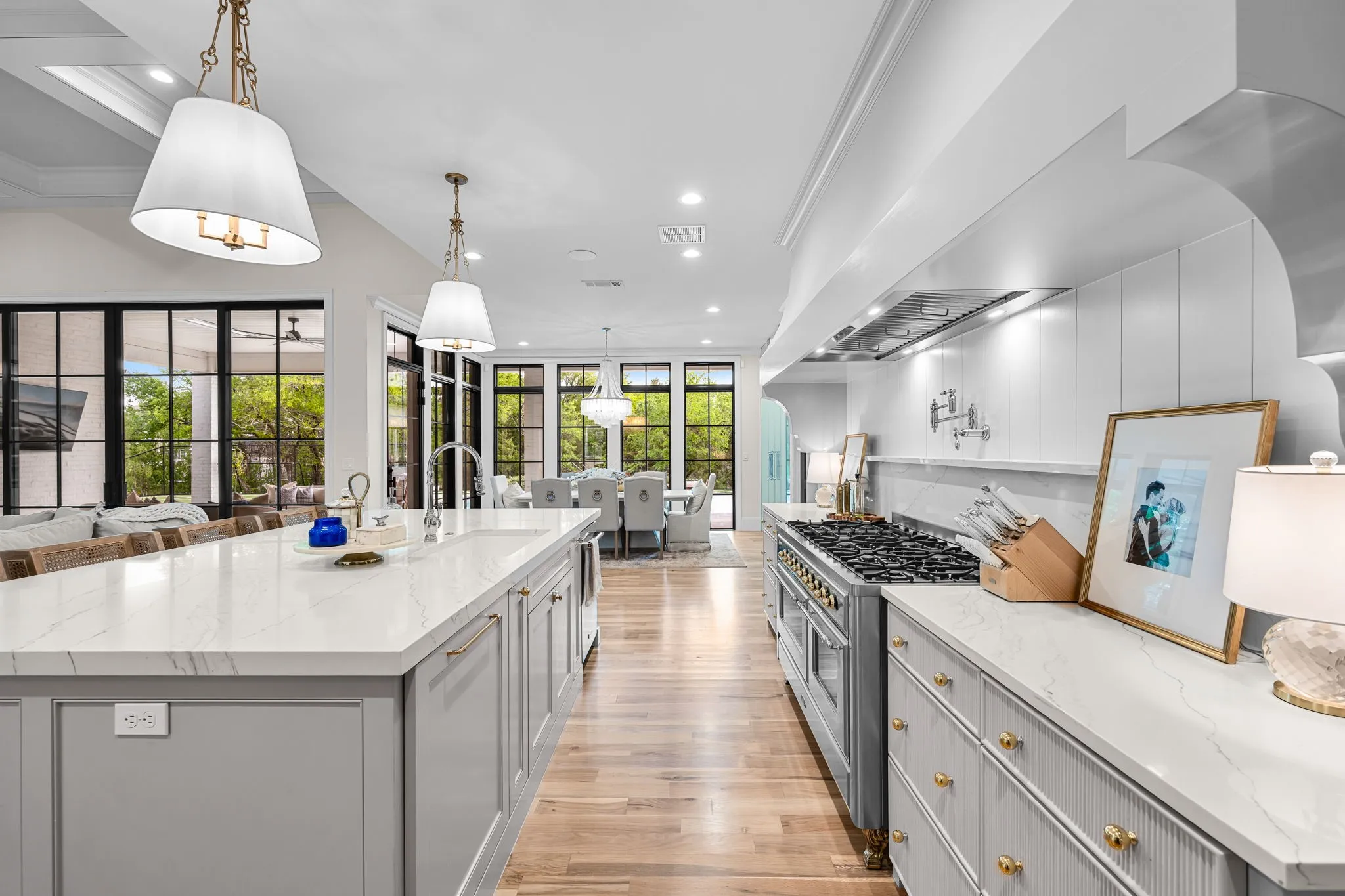 The sliding glass doors and the wall of windows allows in abundance of light to brighten the home