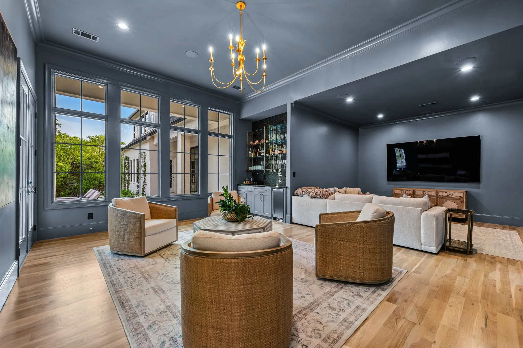 Separate den and  media room overlooking the backyard oasis