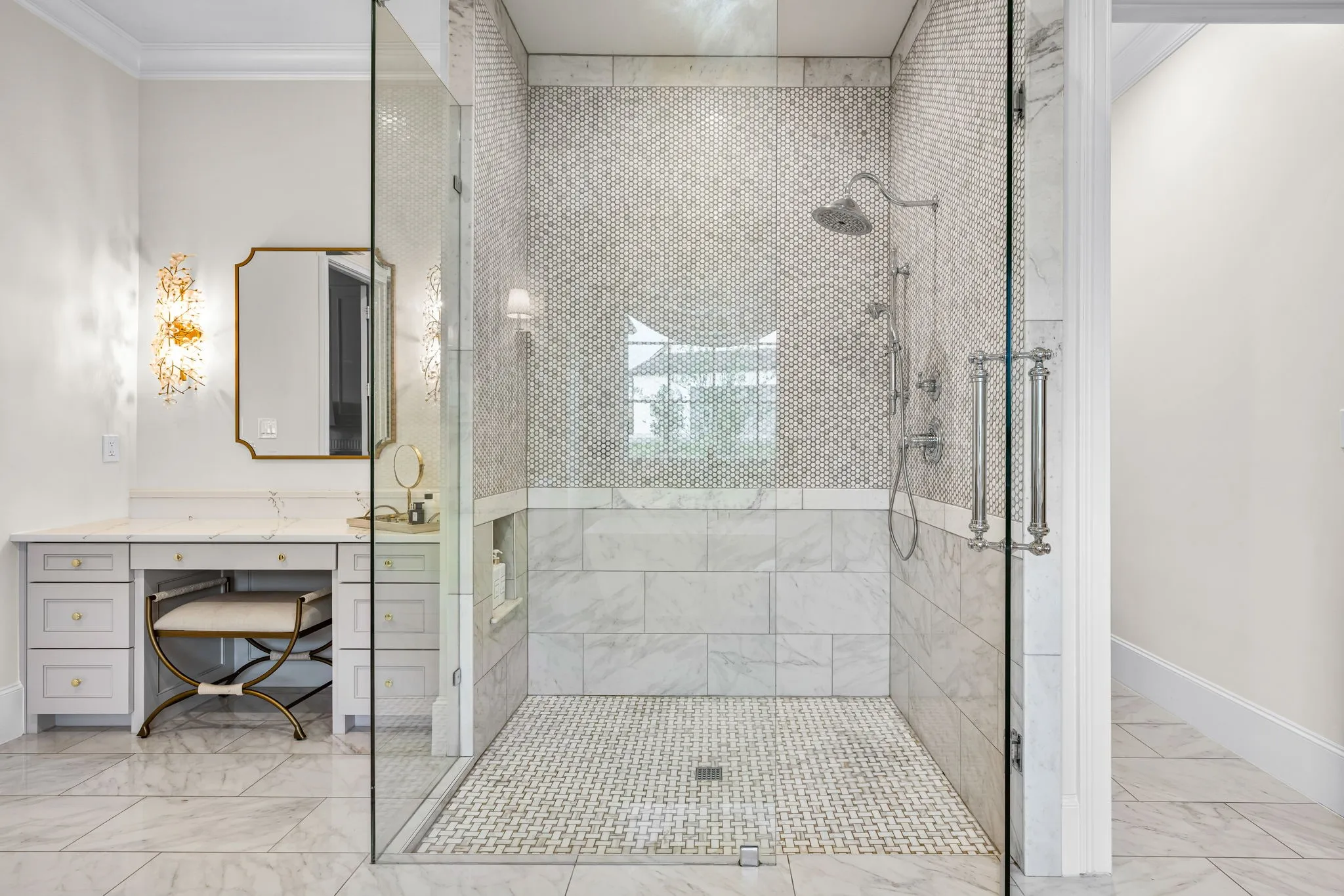 Large walk in shower with tile detailing to perfection. Makeup vanity nestled beside the shower