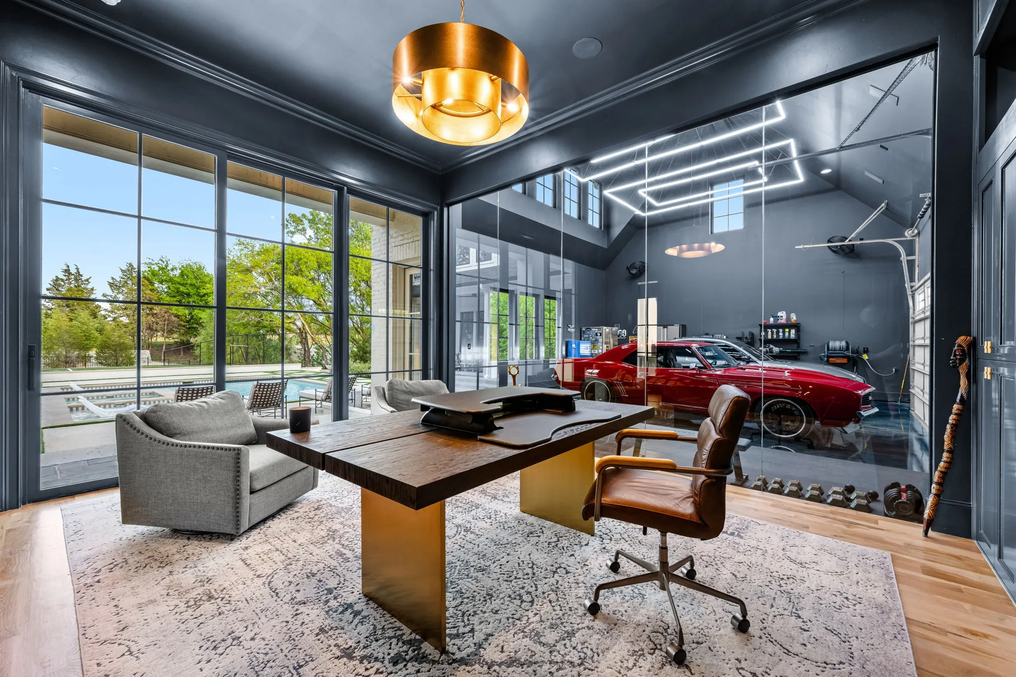This premier office set up overlooking the backyard oasis will have everyone ready to work from home!
