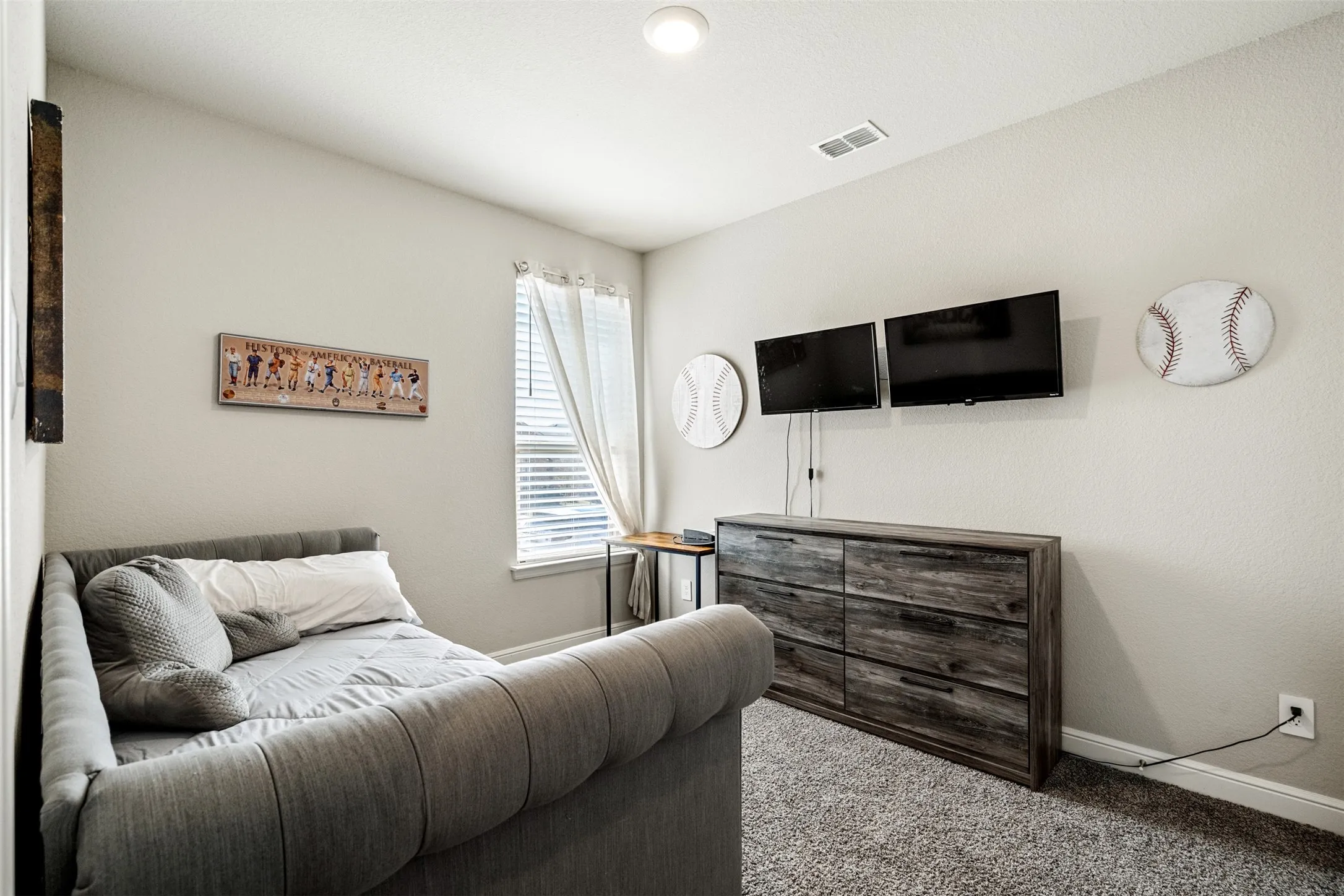 Carpeted bedroom with baseboards