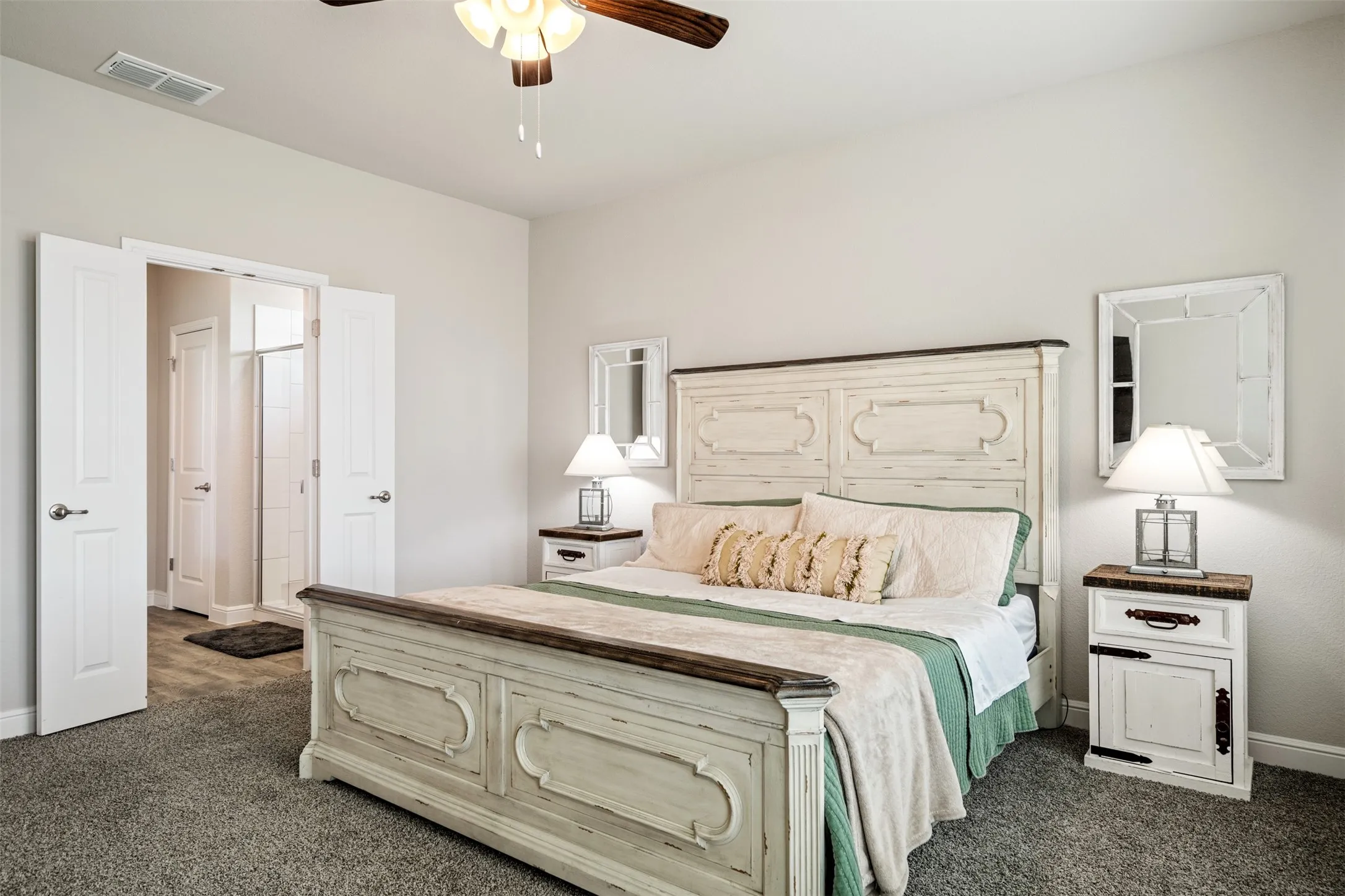 Bedroom featuring dark carpet and a ceiling fan