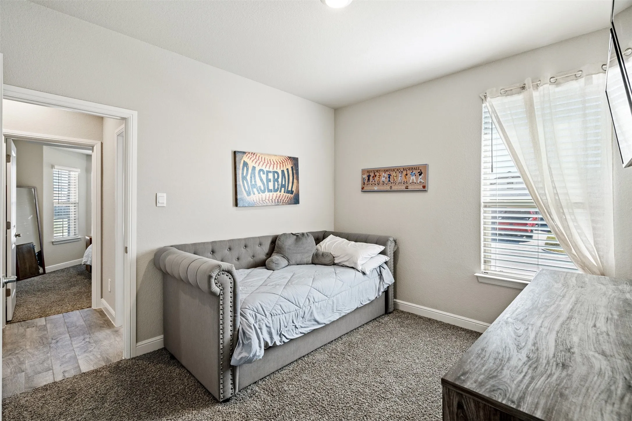 Carpeted bedroom with baseboards