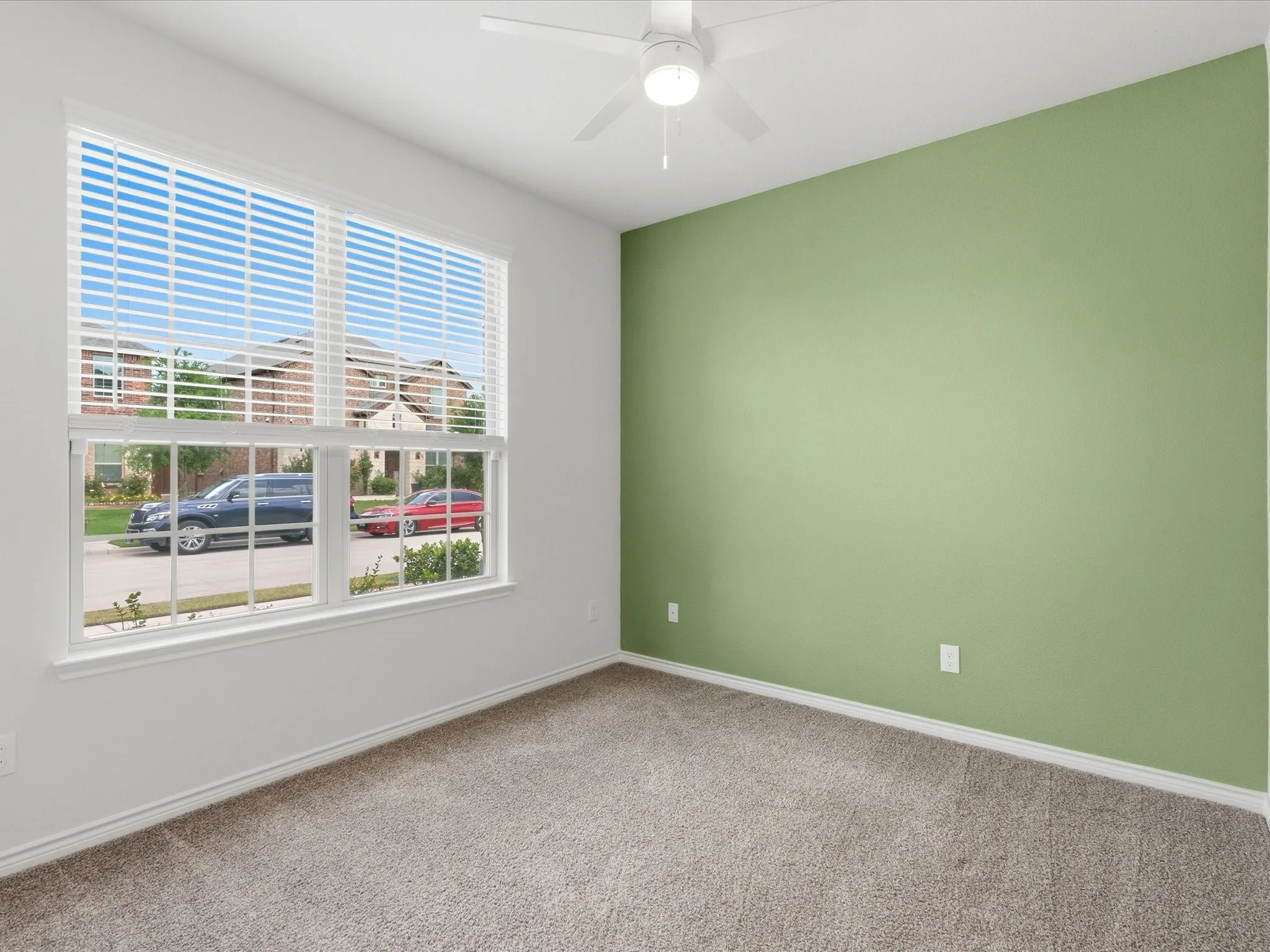 Additional secondary bedroom with flexible use for family or workspace needs.