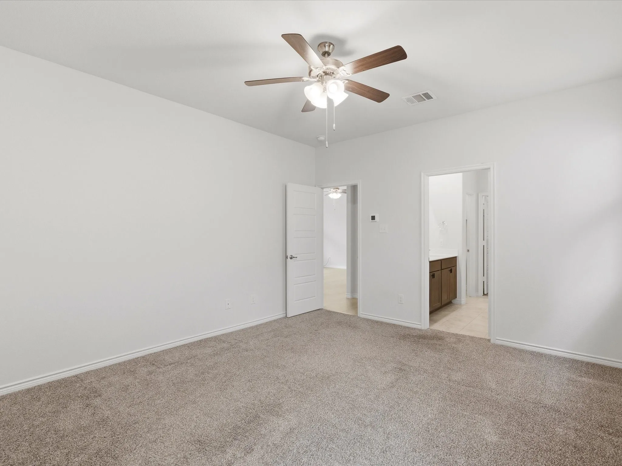 Private primary suite with plenty of space to relax and unwind.