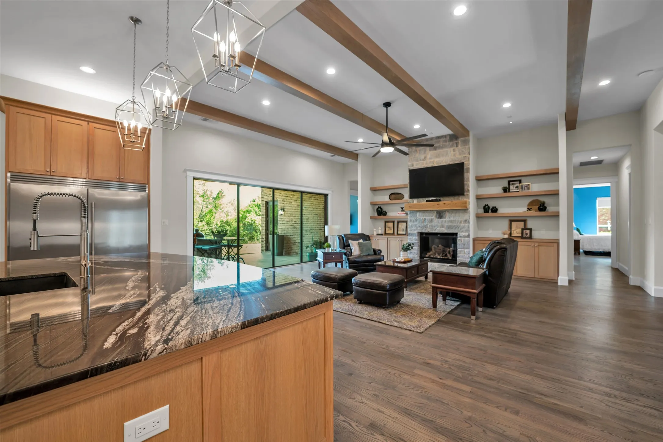 Stone fireplace with flanking floating shelves.