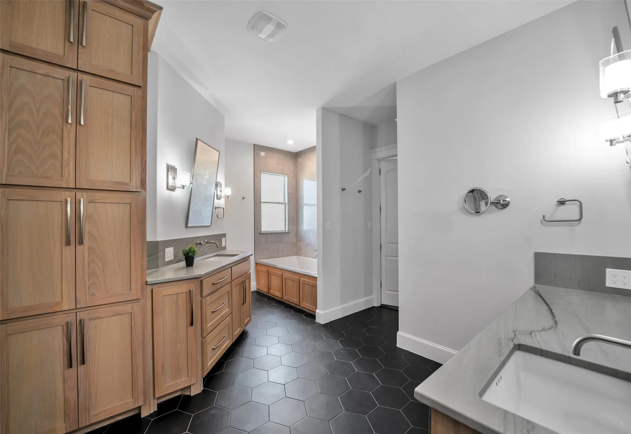 Spa bath with two closets.