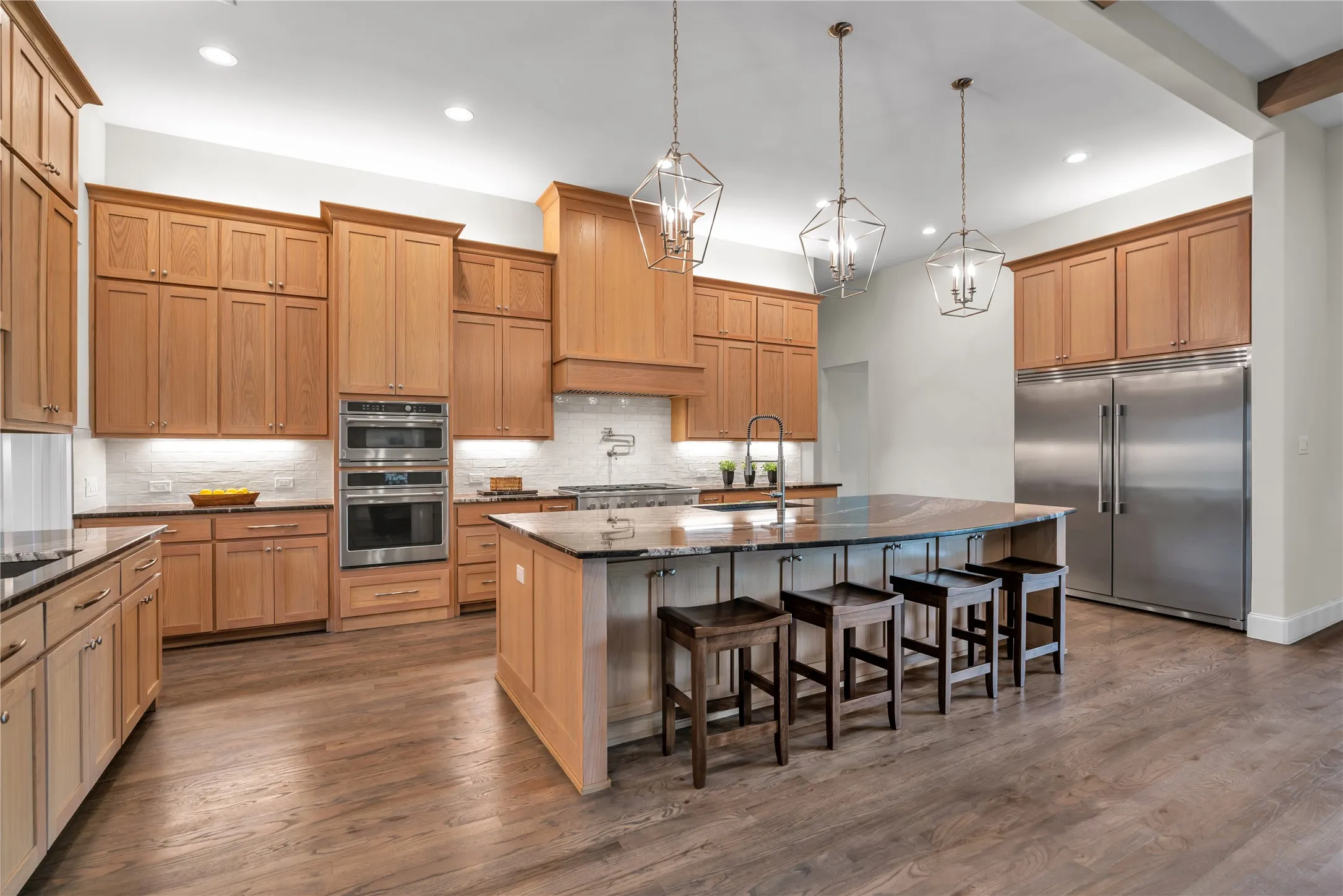 Chef's kitchen with stainless steel appliances.