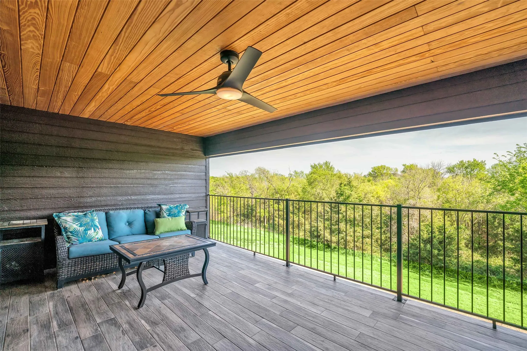 Enjoy the covered patio off the upstairs entertainment room.